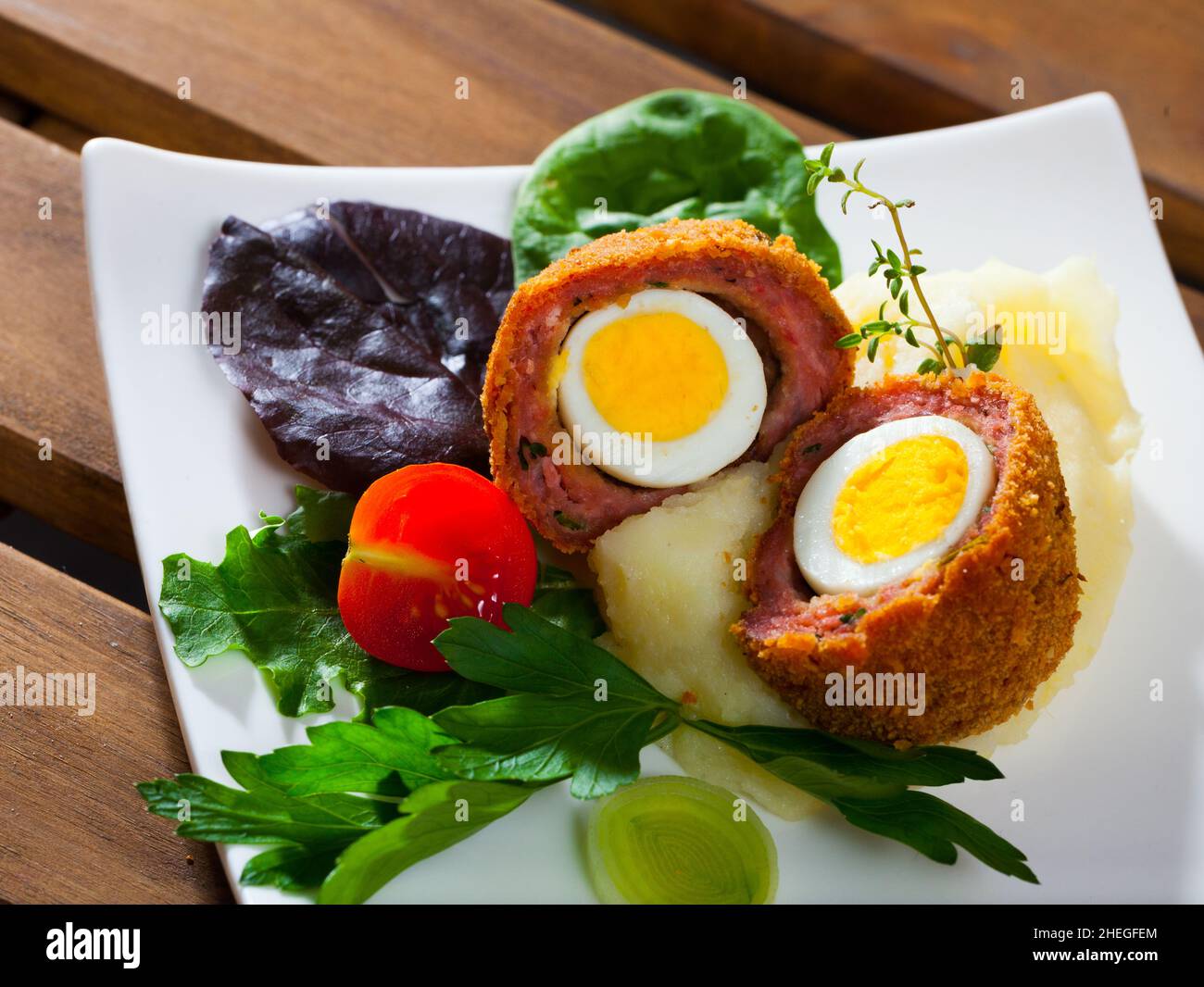 Quail egg wrapped in sausage meat Stock Photo Alamy
