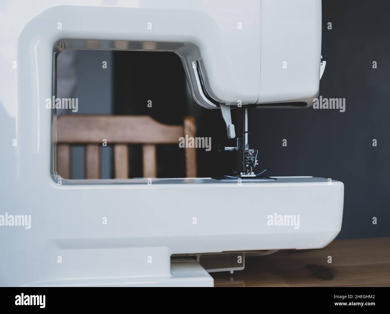 Sewing machine on a table in a sewing workshop Stock Photo