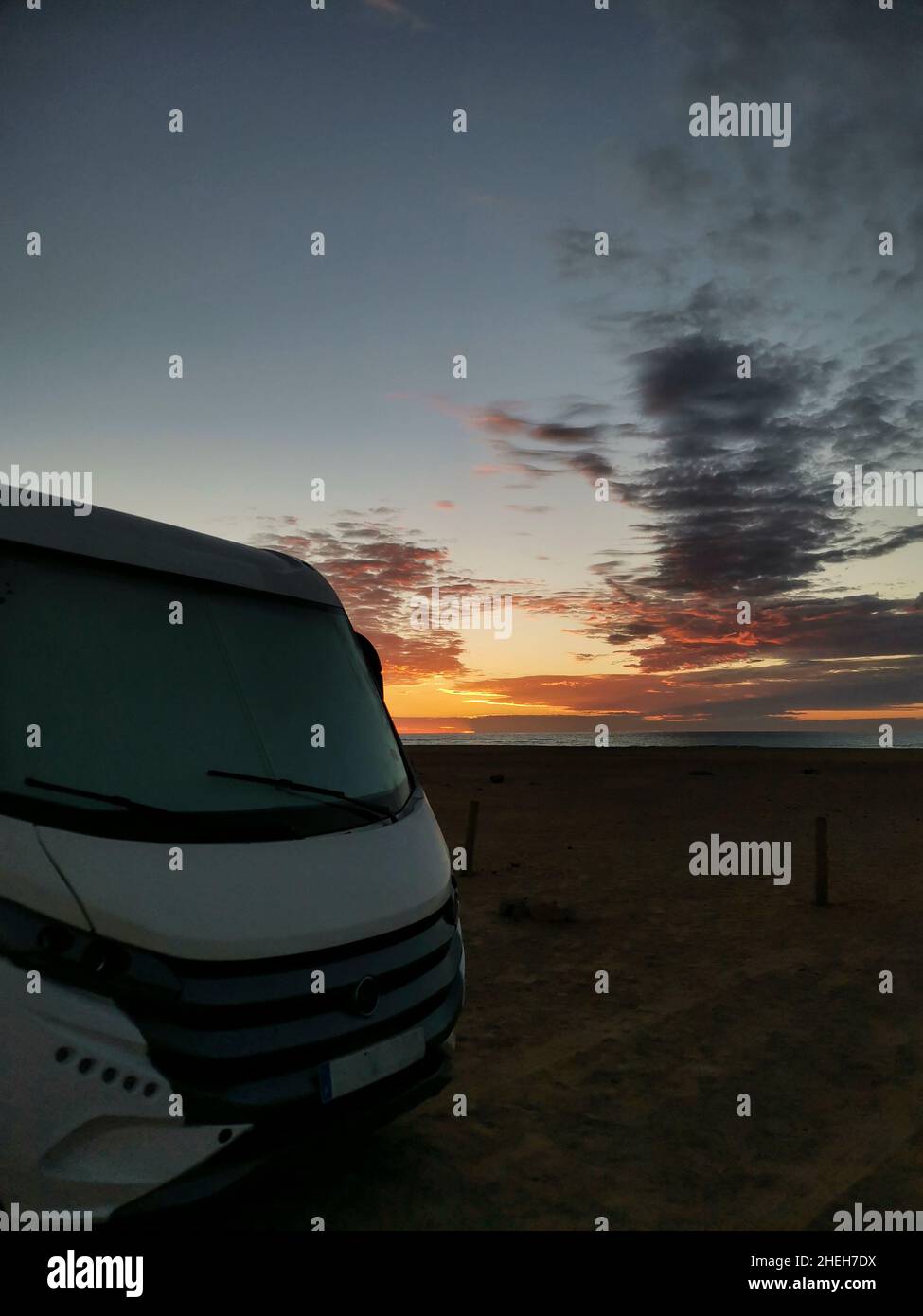 Travel vacation lifestyle with camper parked at the beach with sea view ...