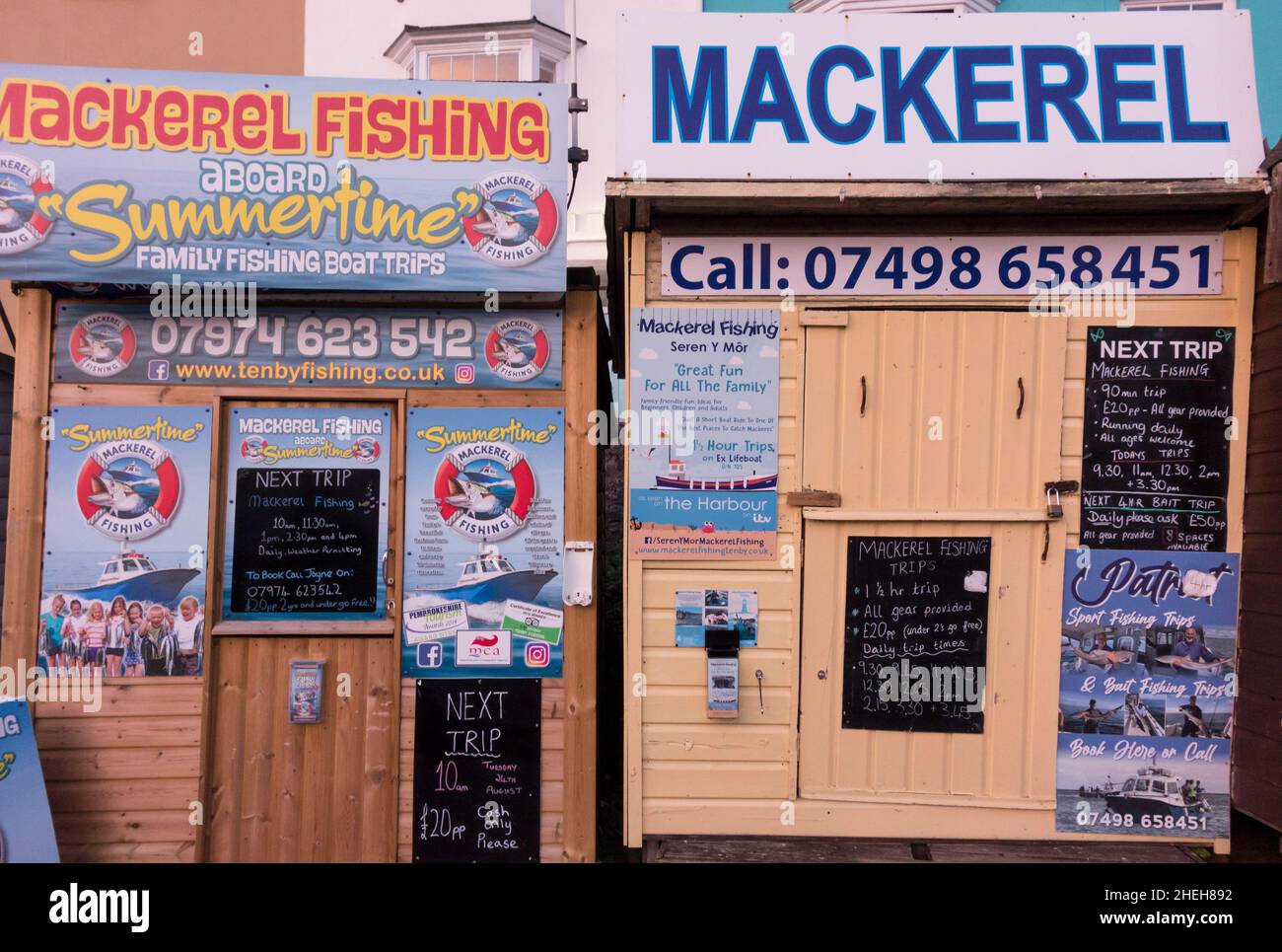 Mackerel fishing boat trip kiosk at harbourside, Tenby, Pembrokeshire, Wales, UK Stock Photo