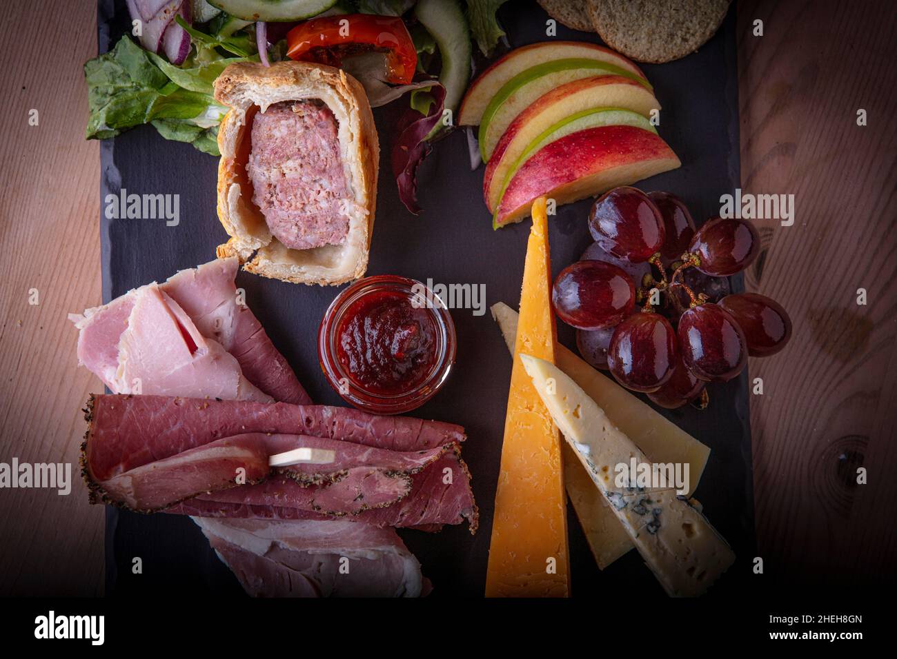 Ploughmans Lunch of meats and fruit. Stock Photo
