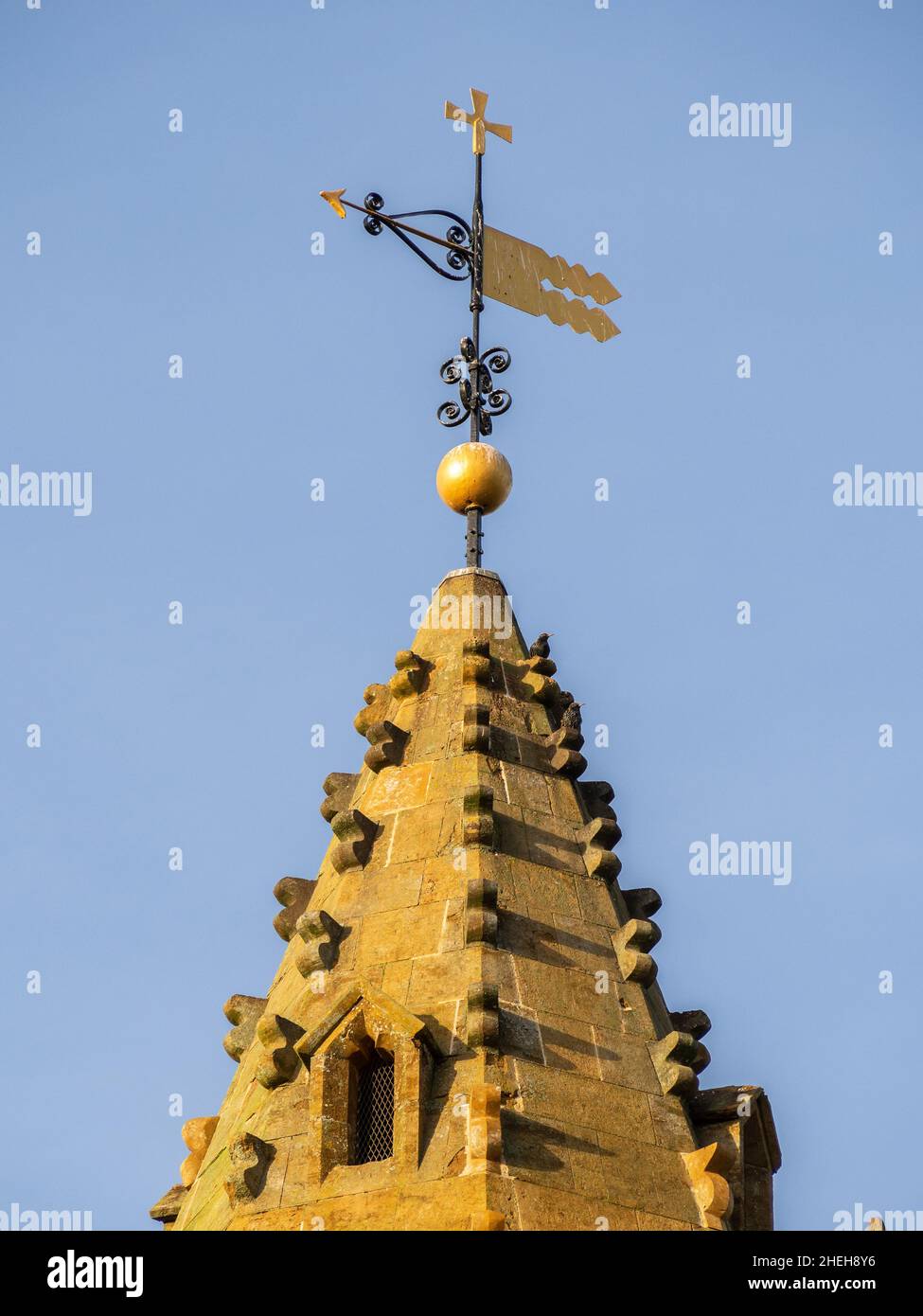 Parish church of the Holy Cross, Milton Malsor, Northamptonshire, UK; close up of the spire and weather vane Stock Photo