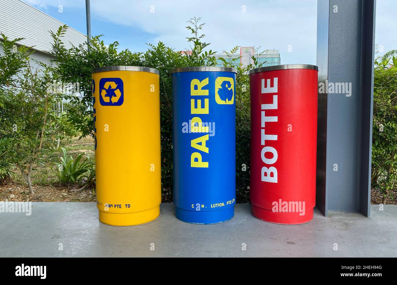 Singapore - Feb 12, 2020. Colorful trash cans on the street in Singapore. Singapore is one of the best waste sorting countries in the world. Stock Photo
