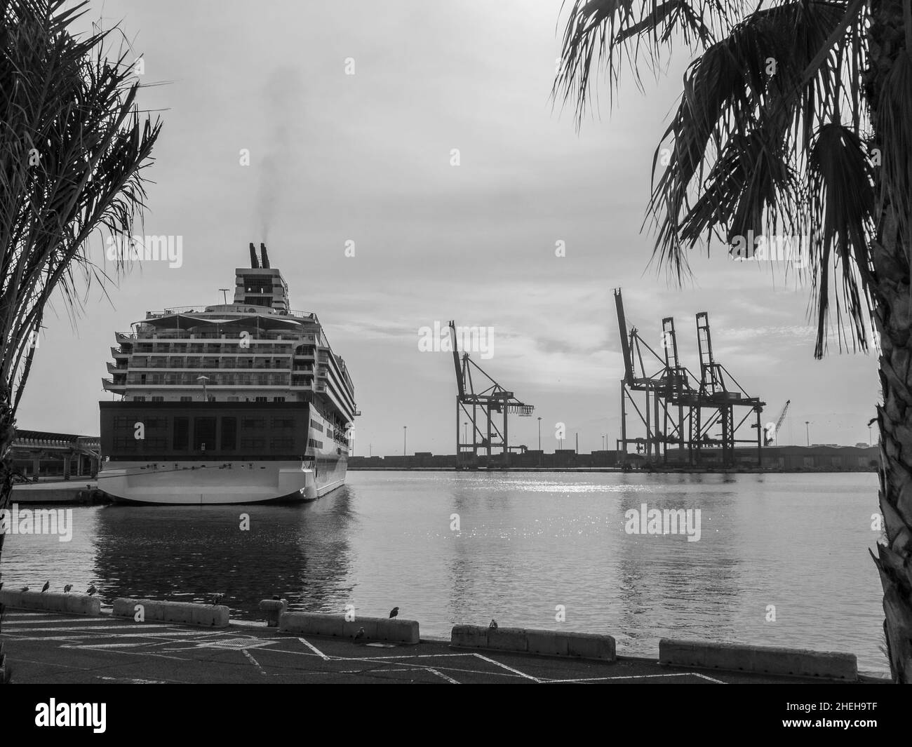 A large cruise ship anchored at a quay in Malaga harbour Stock Photo