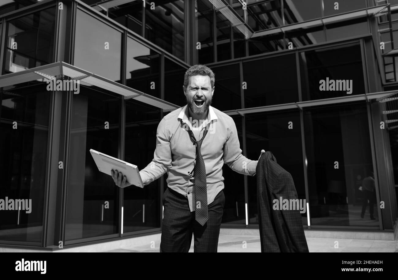 frustrated businessman man shouting in rage with computer and jacket ...