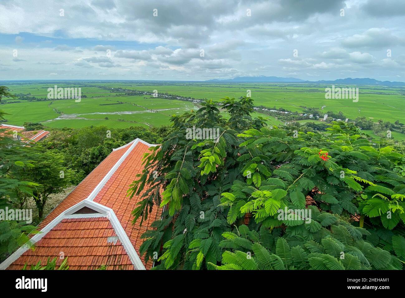 Roof top of brick house with mountain view in Mekong Delta, Vietnam. Stock Photo