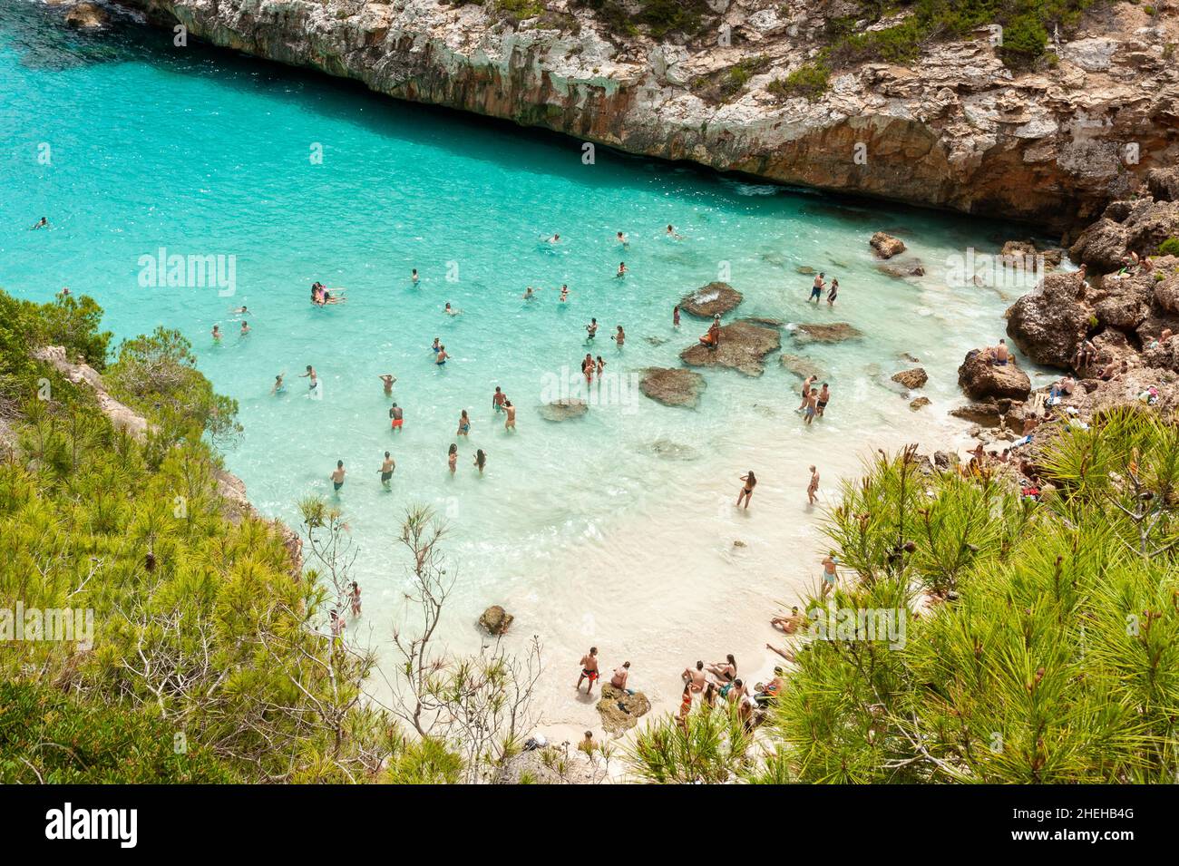 People enjoying beach life at Cala d'es Moro, Mallorca, Balearic islands, Spain Stock Photo