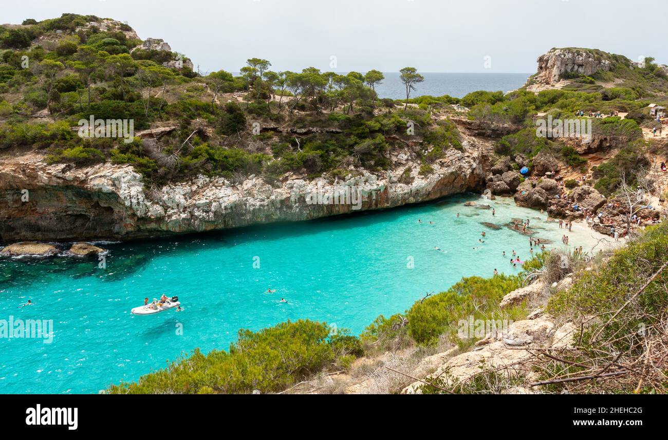 People enjoying beach life at Cala d'es Moro, Mallorca, Balearic islands, Spain Stock Photo