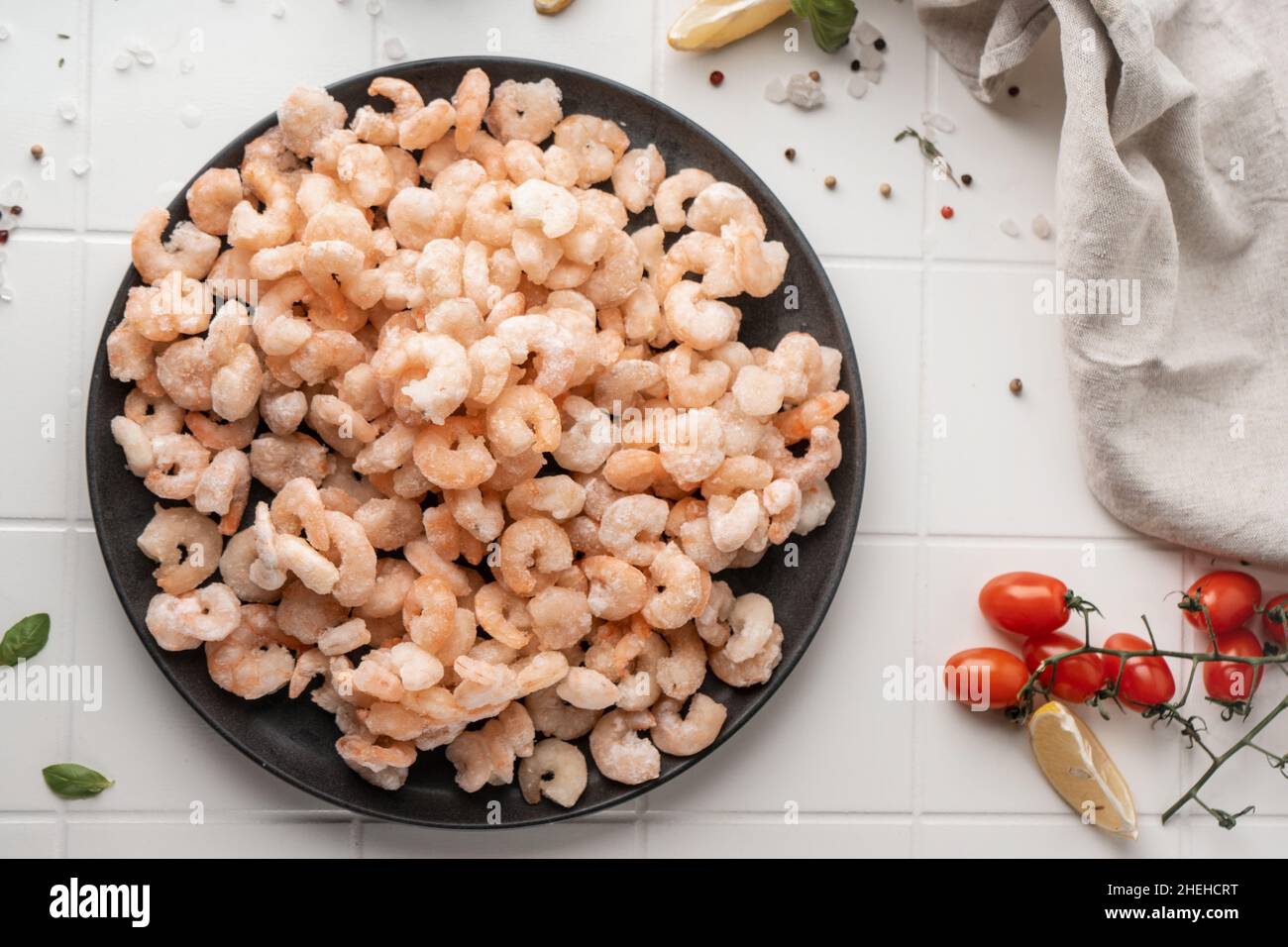 Thawed peeled shrimp, seafood, delicacy. on a white background, in a ...