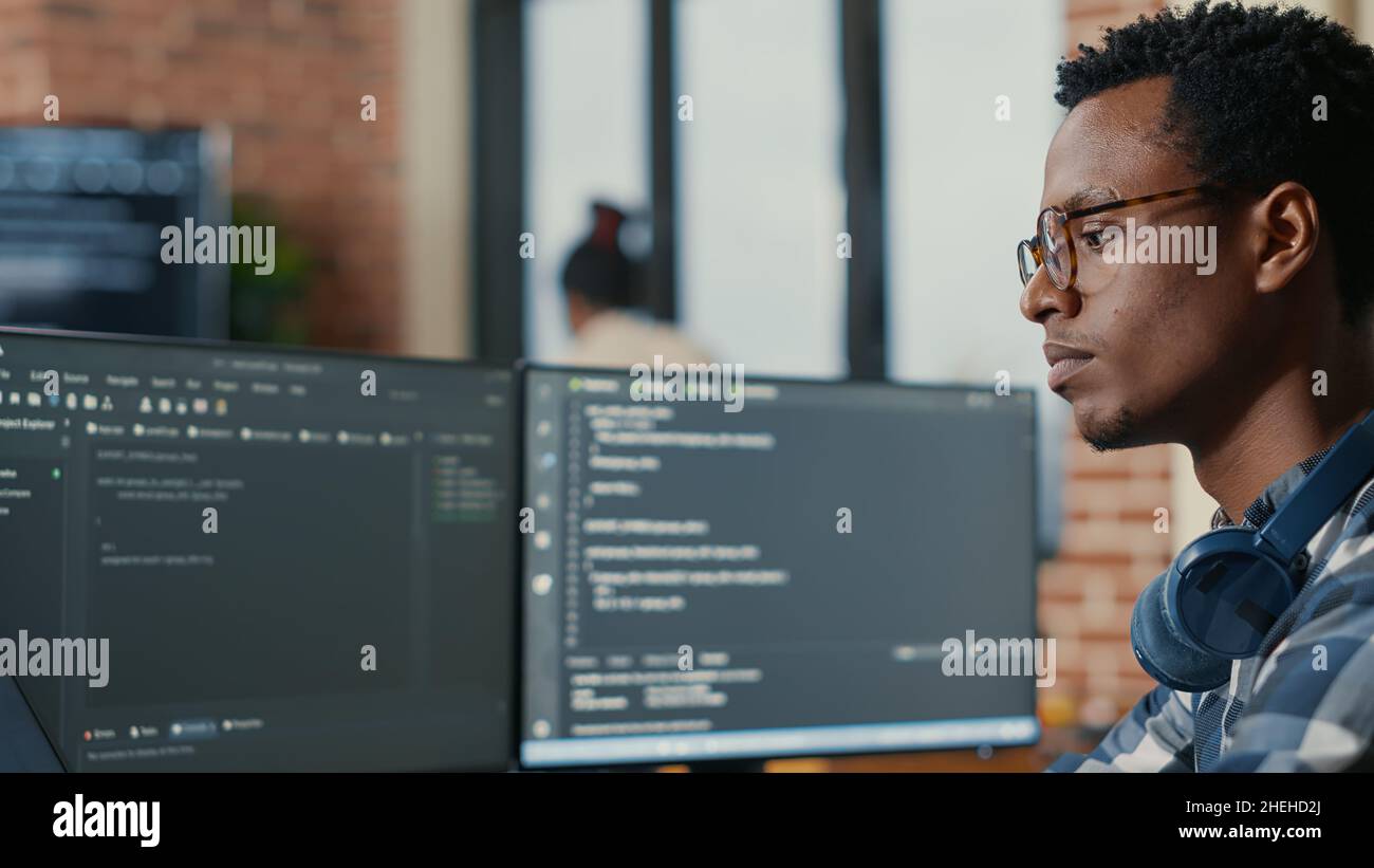 Portrait focused software developer writing hi-res stock photography ...