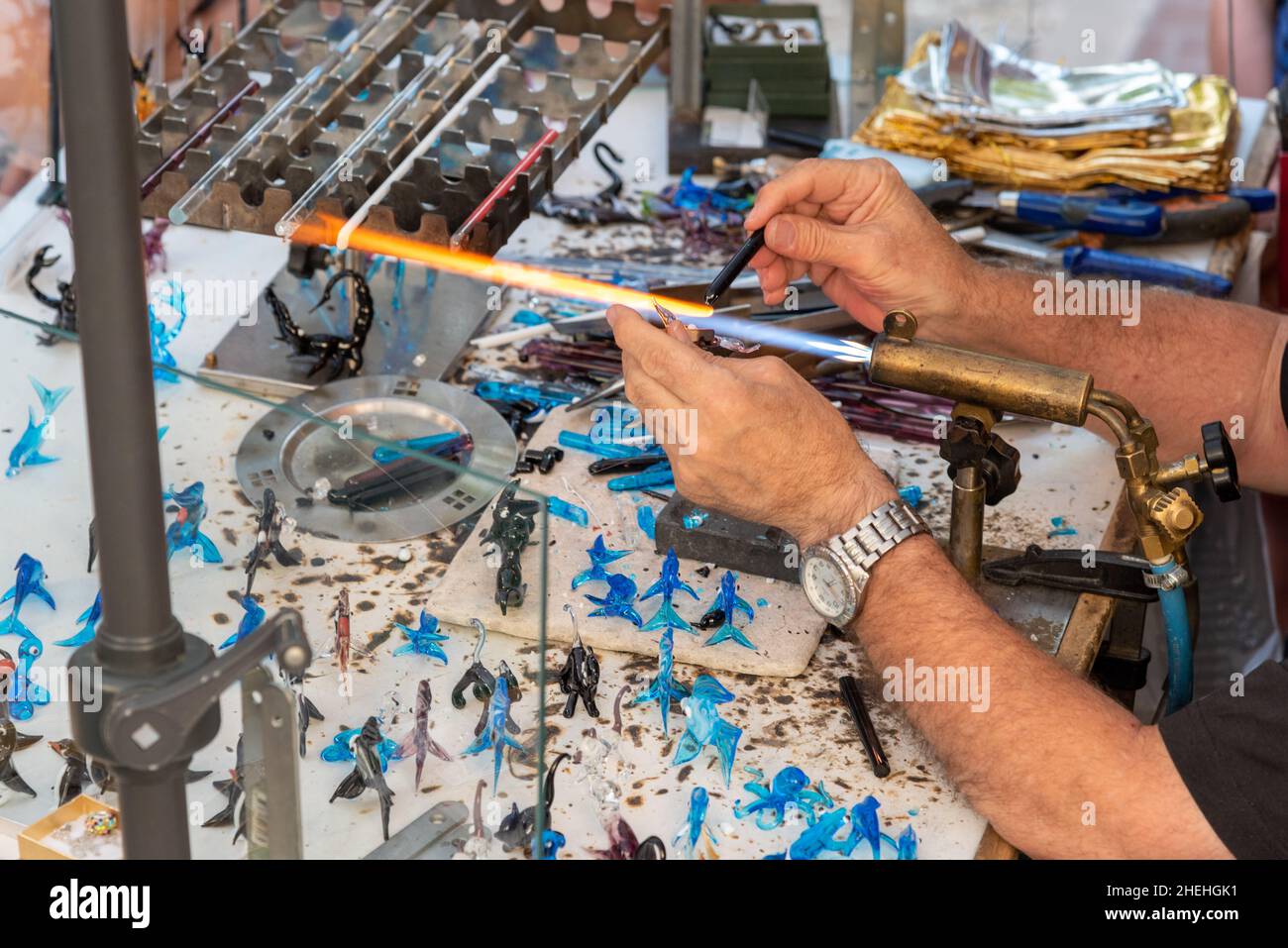 Glassmaker making glass objects in his Stock Photo Alamy