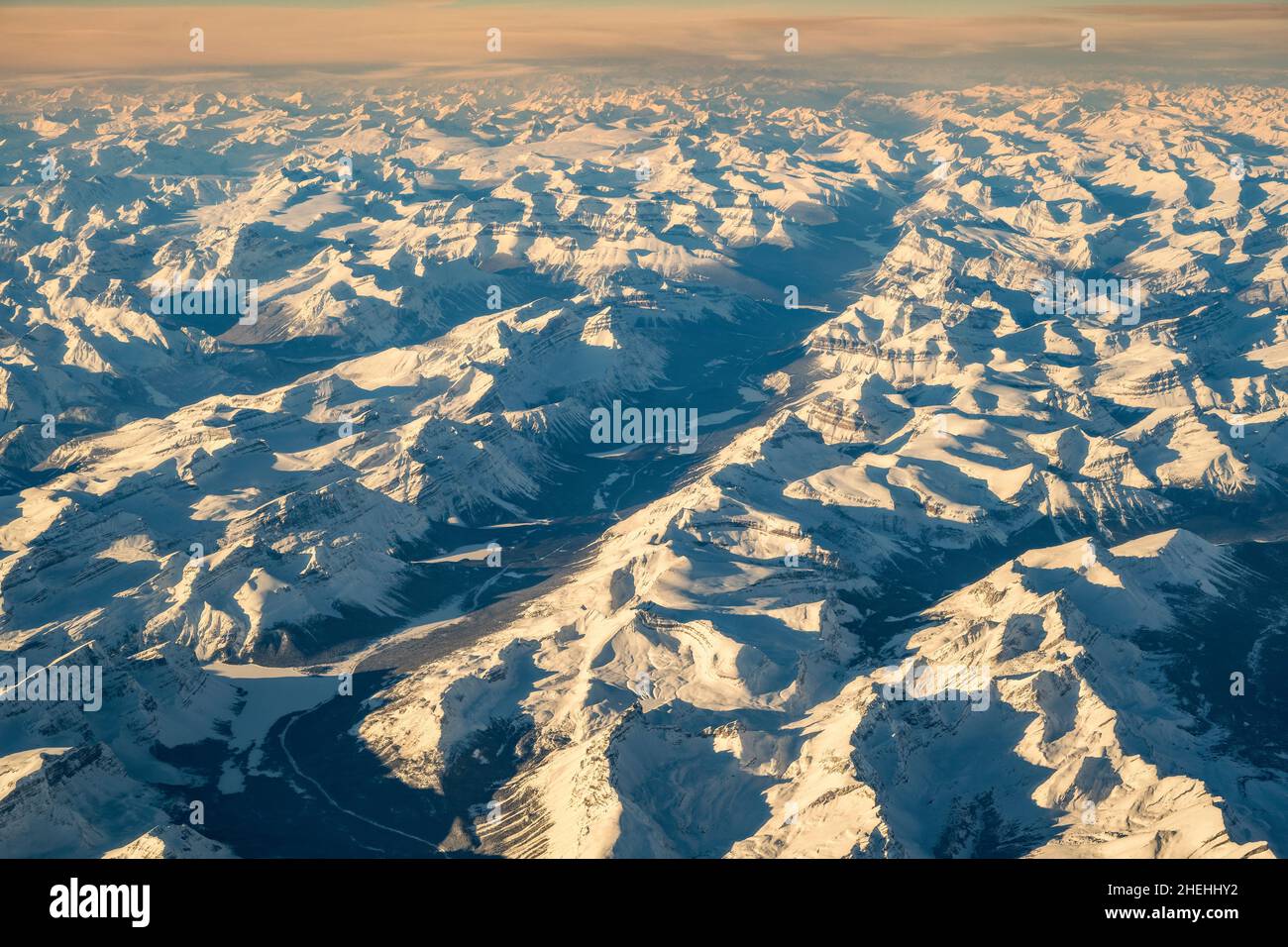Winter aerial view over the snowy Canadian Rockies mountains, Alberta, Canada Stock Photo