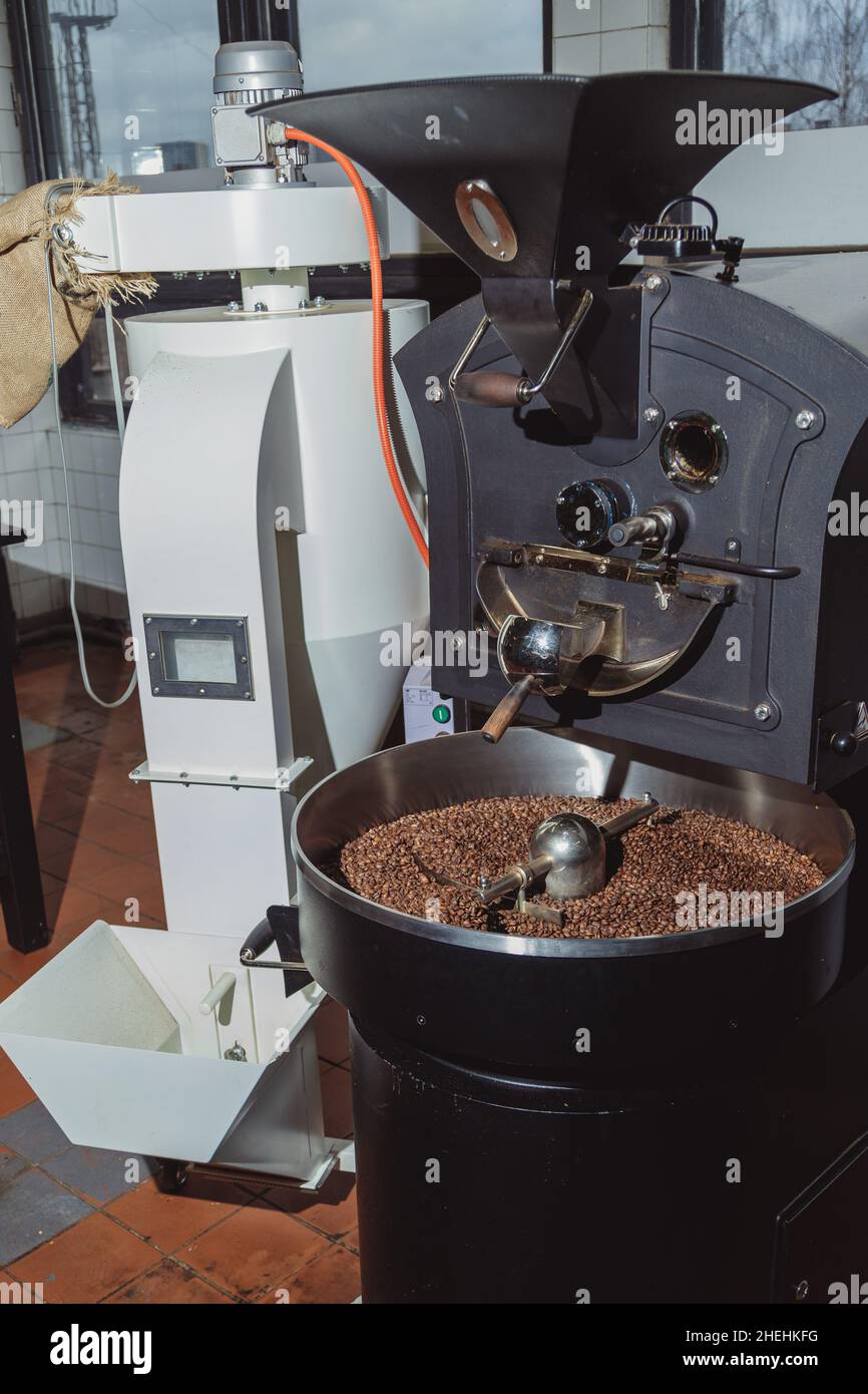 Industrial coffee bean roaster appliance. Roasting coffee transforms