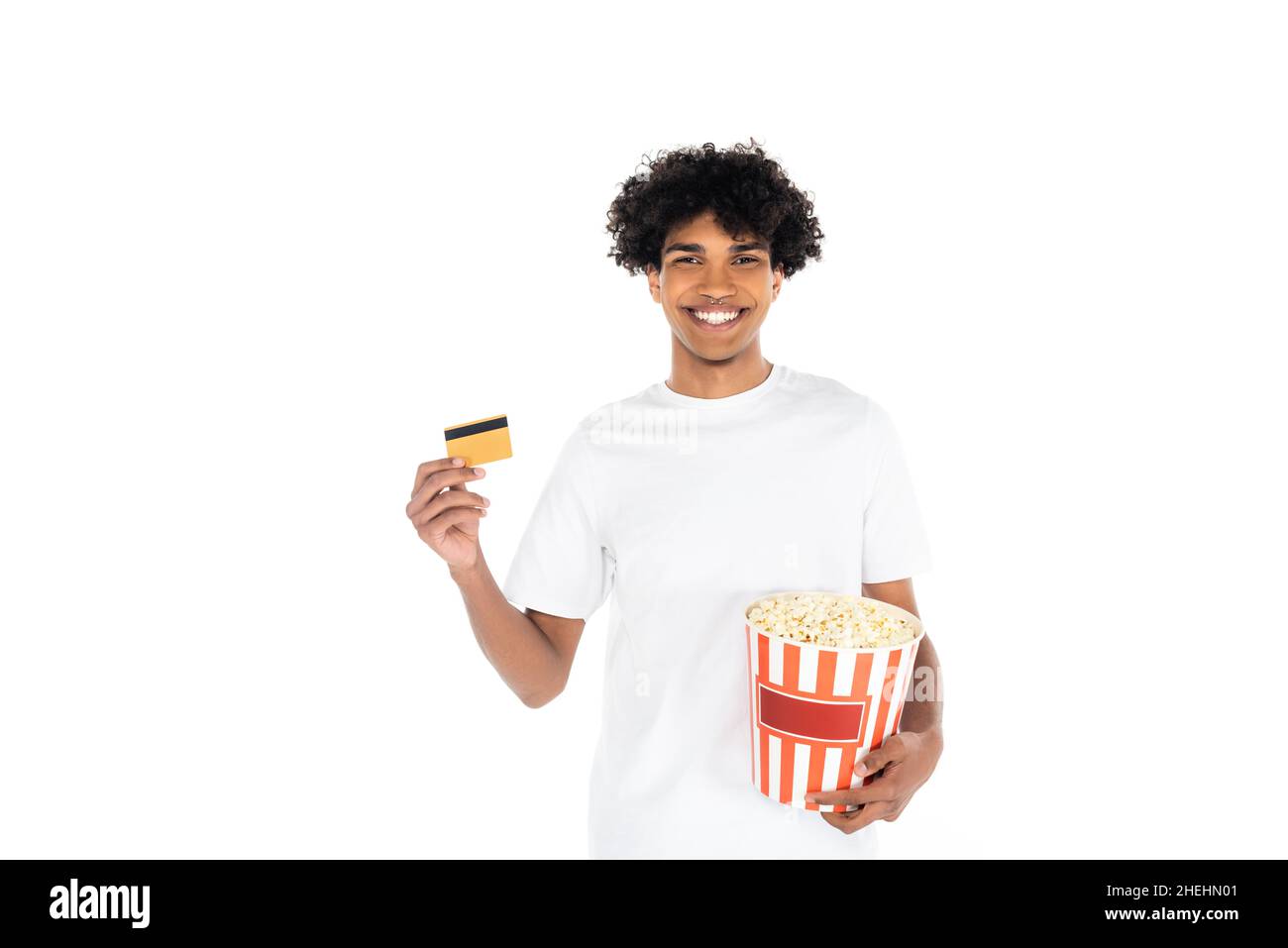 pleased african american man holding bucket of popcorn and credit card