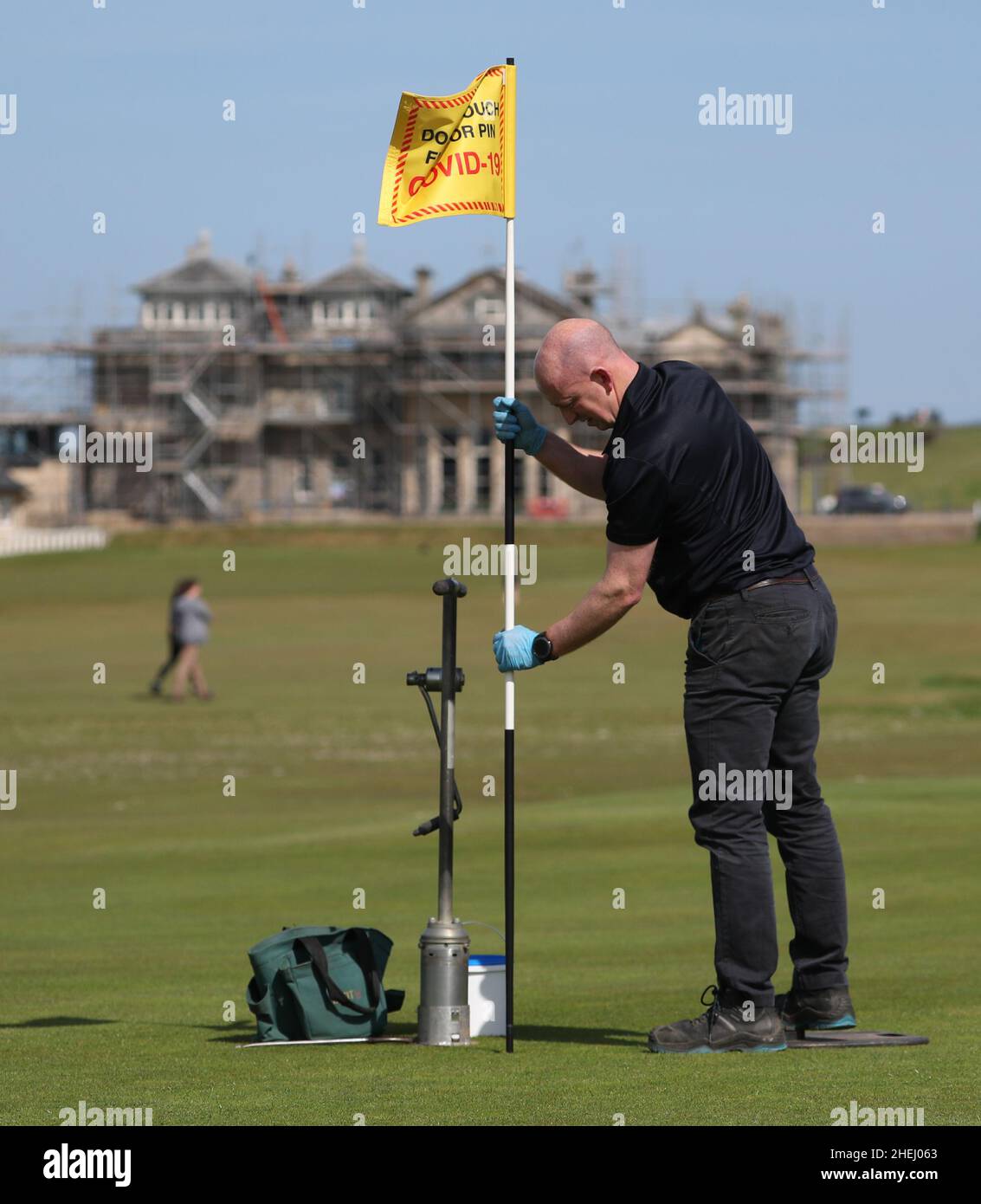 File photo dated 20/05/20 of Director of Green Keeping at St Andrews Links Trust Sandy Reid cutting a hole on the 17th green on the Old Course at St Andrews. Police are in contact with the Cabinet Office over claims Martin Reynolds, the Prime Minister's principal private secretary, organised a 'bring your own booze' party in the garden behind No 10 during England's first lockdown on May 20, 2020. Issue date: Tuesday January 11, 2022. Stock Photo