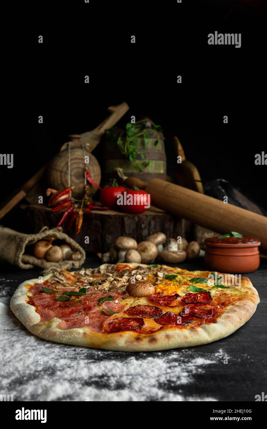 Italian Pizza Four Seasons (Pizza Quattro Stagioni) with different