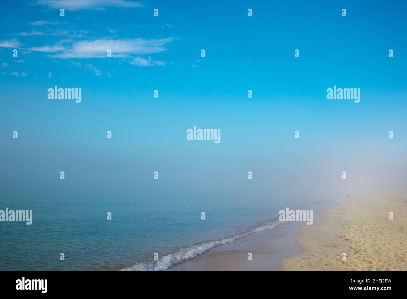 Beach blue sea, fog, blue sky with clouds of relaxation Stock Photo - Alamy