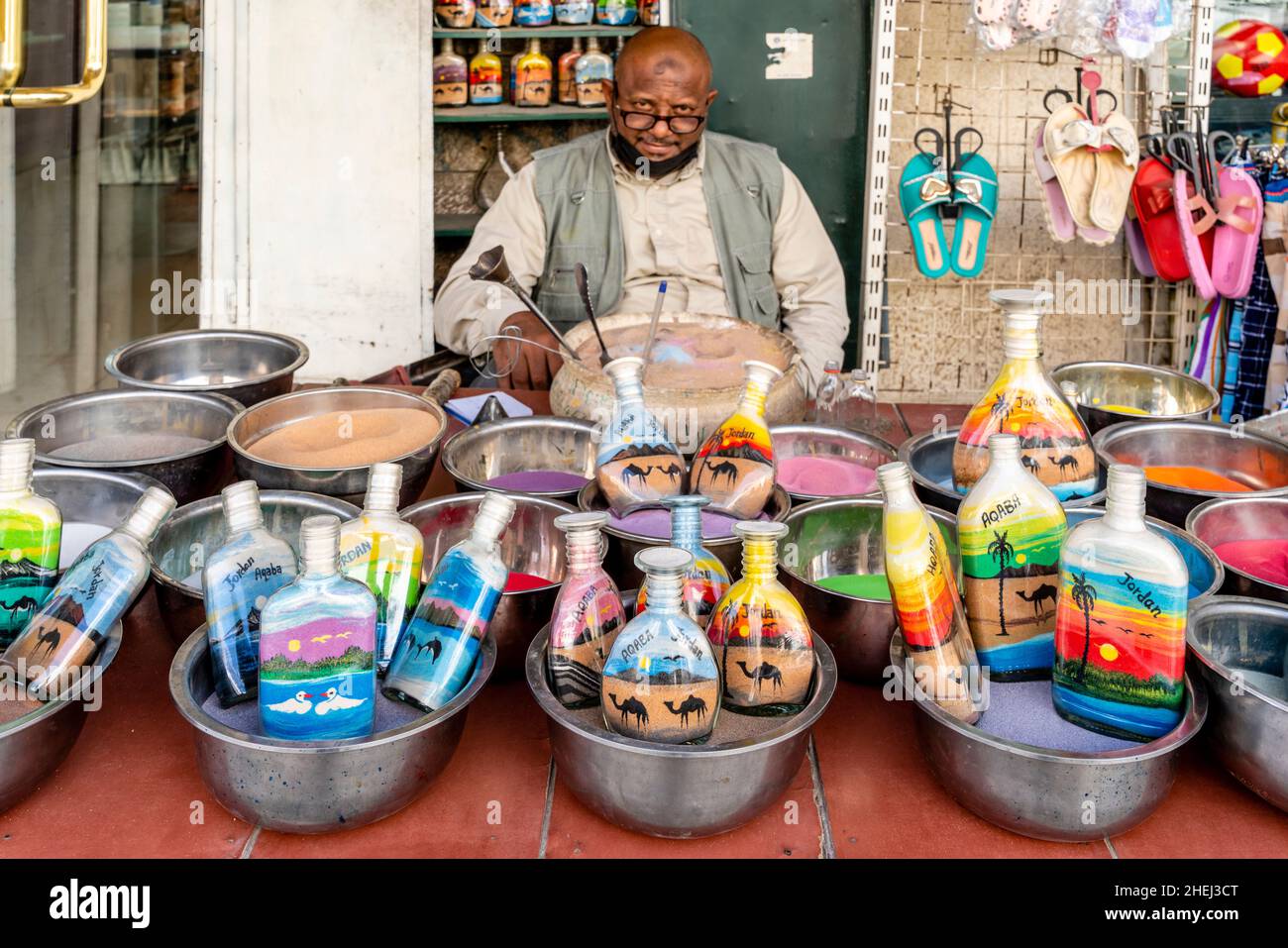 A Sand Artist and His Colourful Sand Bottles, Aqaba, Aqaba Governorate, Jordan. Stock Photo