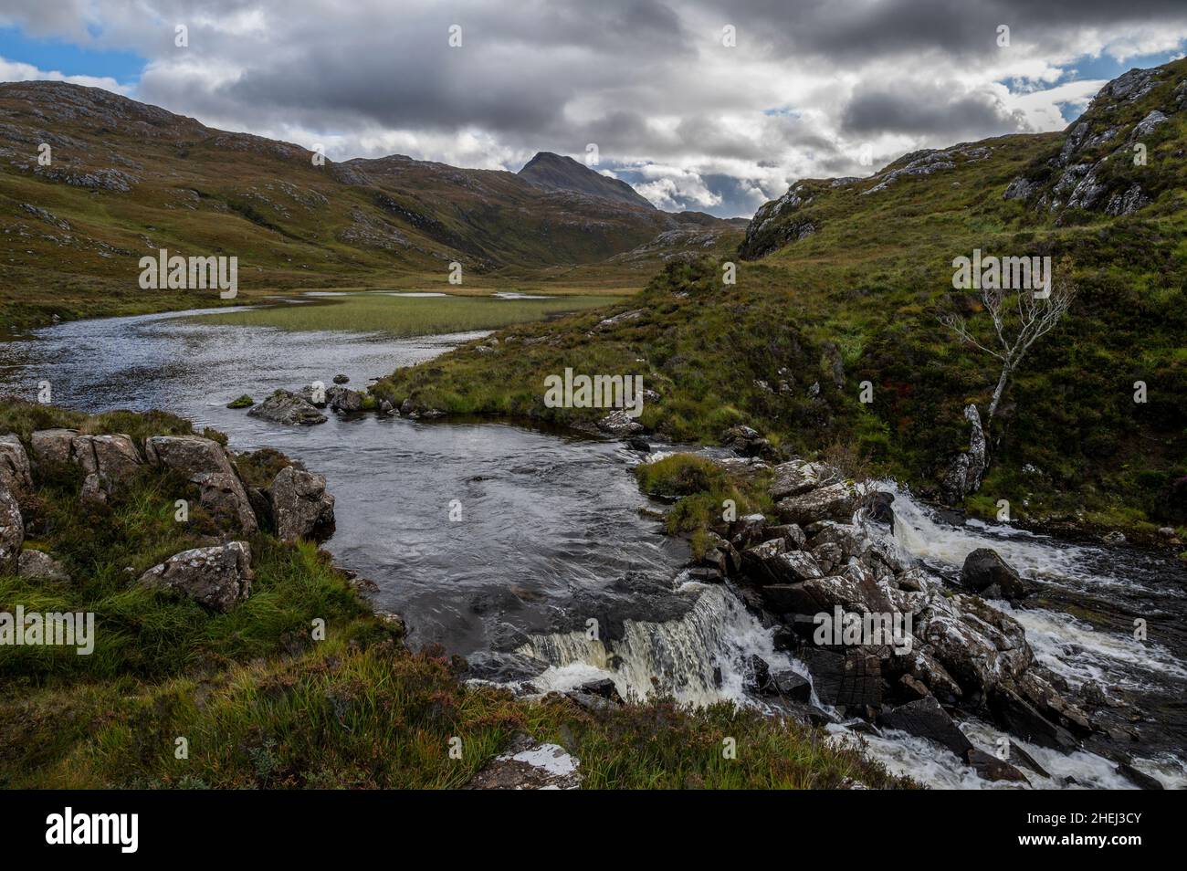 Abhainn Bad na h-Achlaise river with Canisp mountain view in the background Stock Photo
