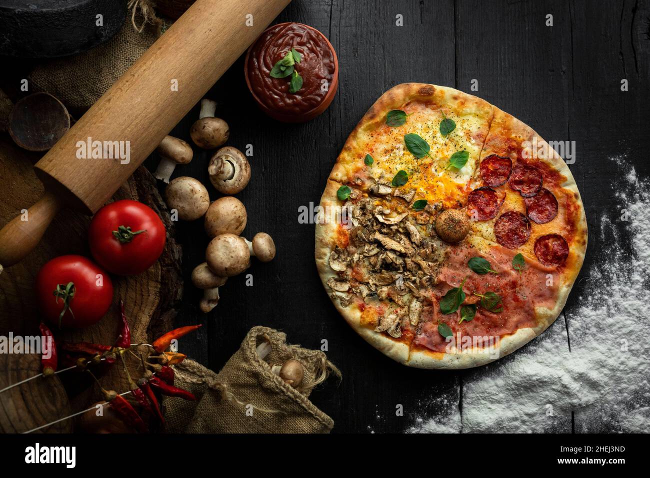 Italian Pizza Four Seasons (Pizza Quattro Stagioni) with different