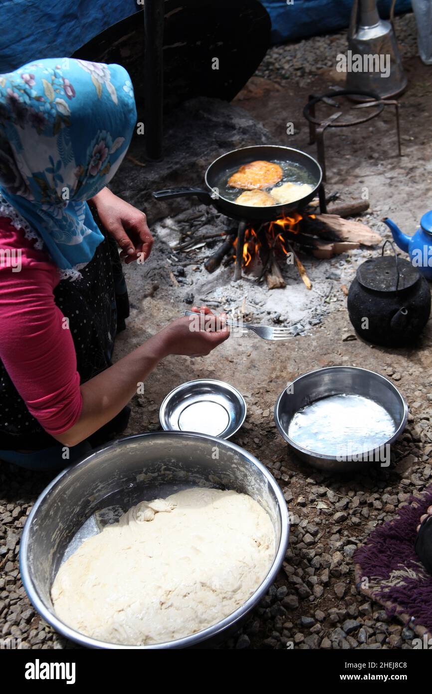 frying dough in wood fire Stock Photo Alamy