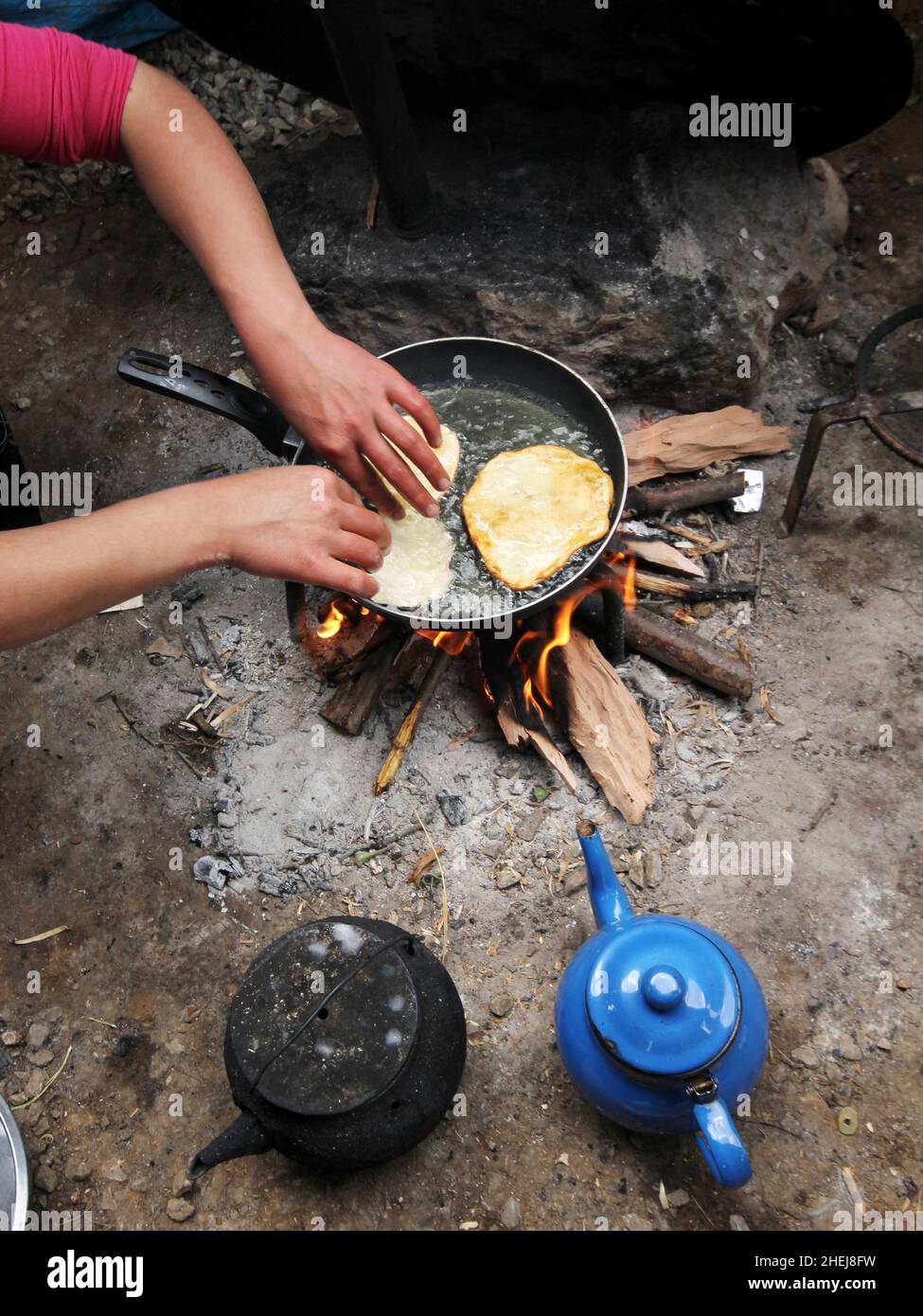 frying dough in wood fire Stock Photo Alamy