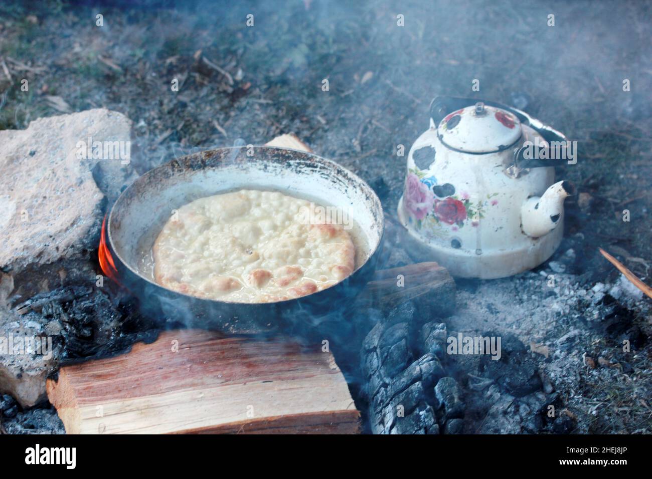 frying dough in wood fire Stock Photo Alamy