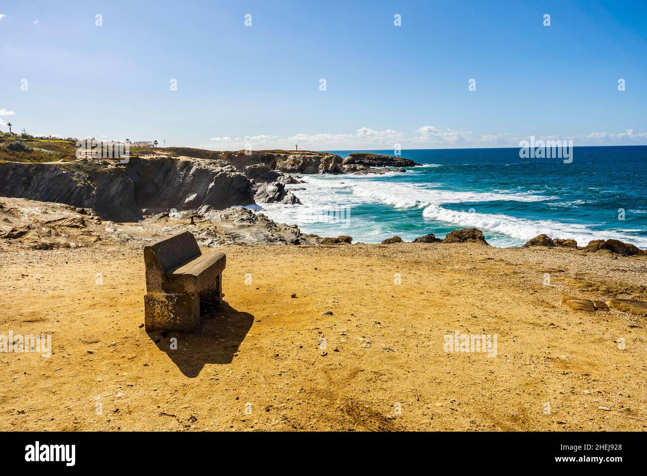 A bench with panoramic view on cliffs and beaches in Porto Covo, Alentejo, Portugal Stock Photo