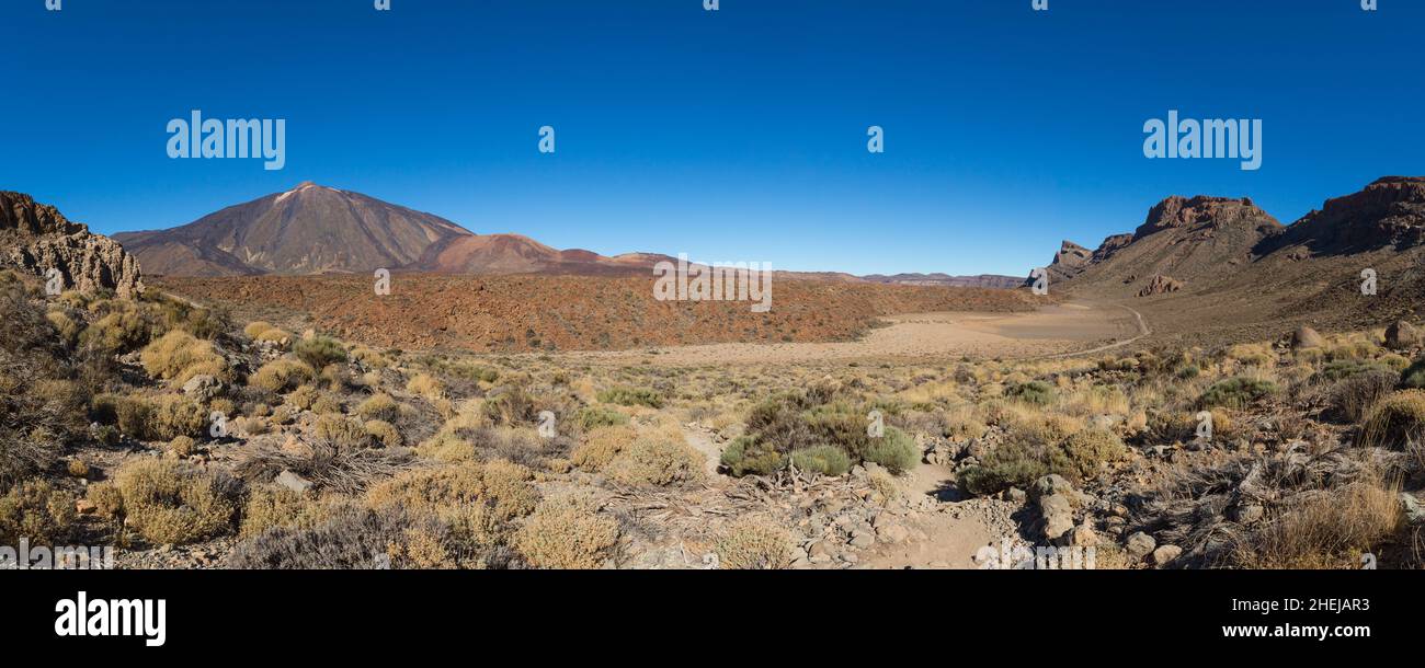 panorama of Teide mountain and surrounding lava fields on Tenerife with blue sky Stock Photo