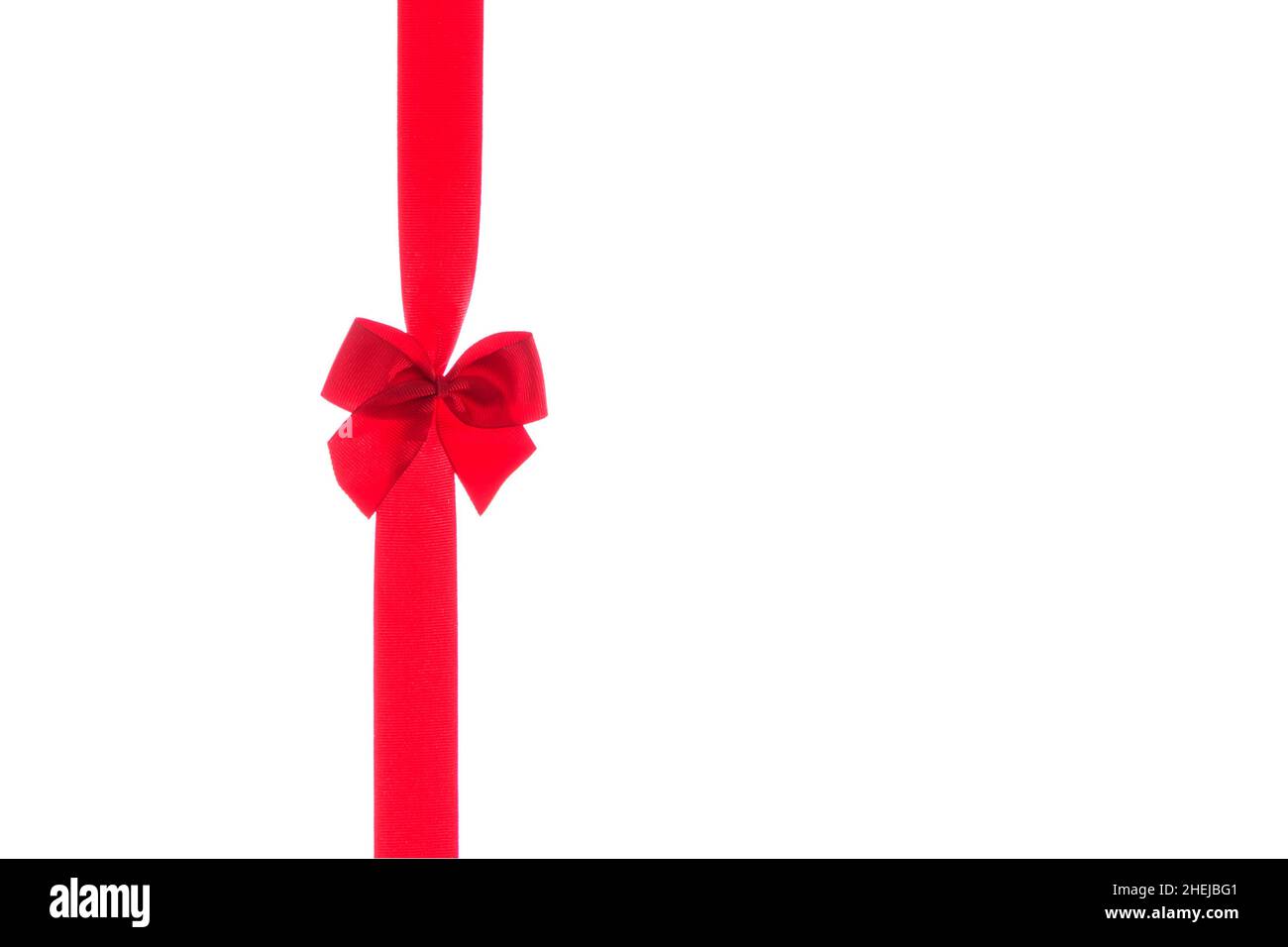 Red ribbon with bow isolated on a white background Stock Photo - Alamy