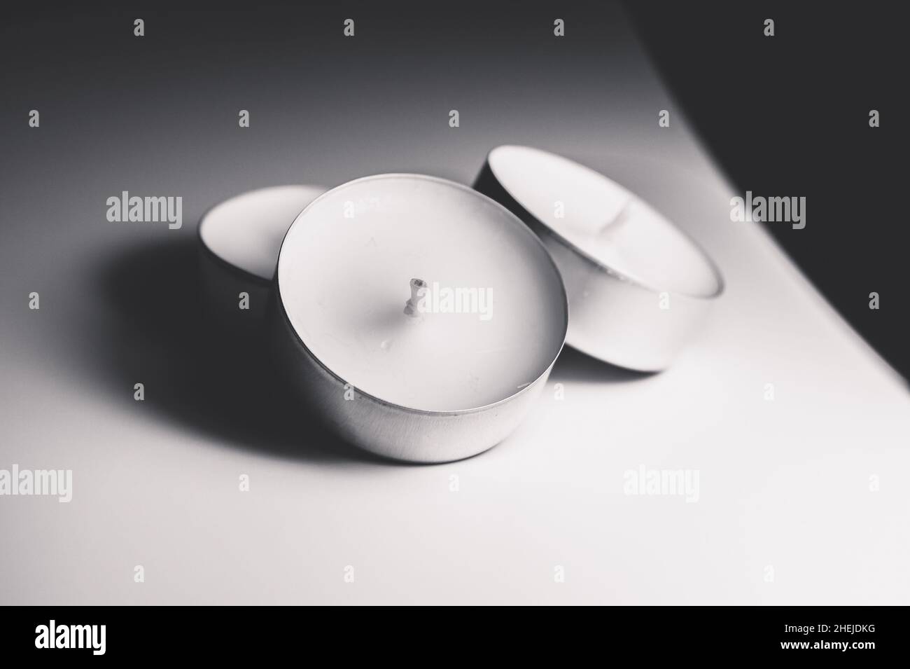 Monochrome white three tea light Stock Photo