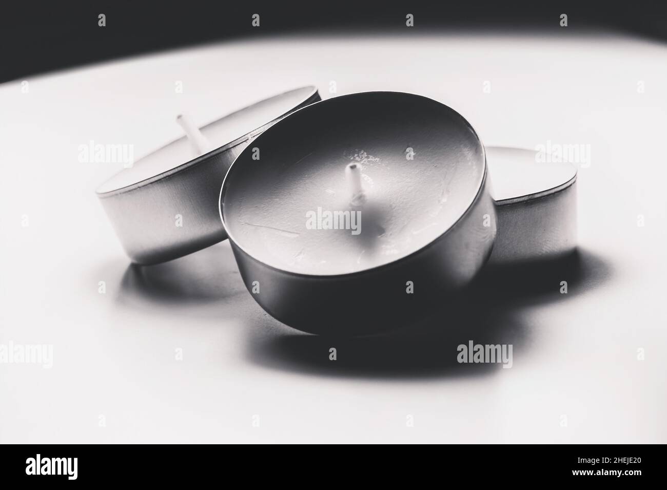 Monochrome white three tea light close up Stock Photo