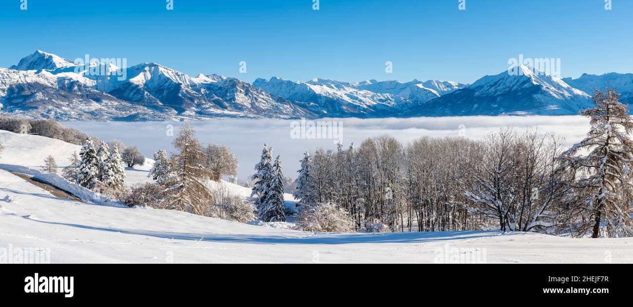 Winter view of the Champsaur Valley with Ecrins National Park mountain peaks in the distance. Hautes-Alpes (Gleize Pass, French Alps). France Stock Photo