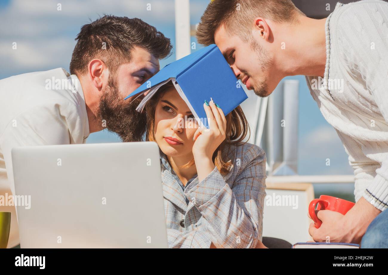 Boring meeting. Office workers talking. Sad secretary, assistant and manager. Business team discuss at the outdoor. Stock Photo