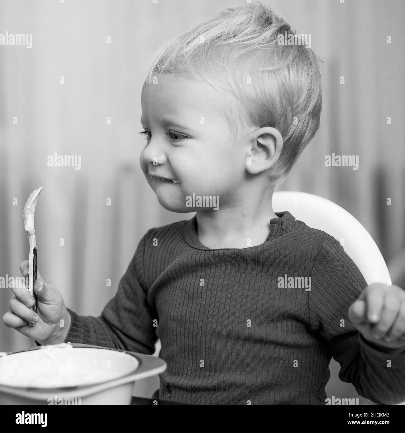 Boy cute baby eating breakfast. Baby nutrition. Eat healthy. Toddler