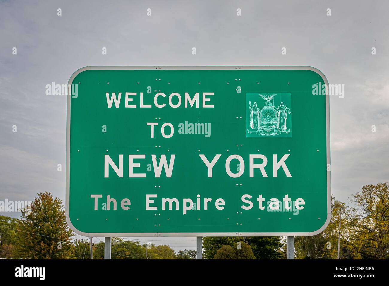 A to New York state line highway sign marking the border with