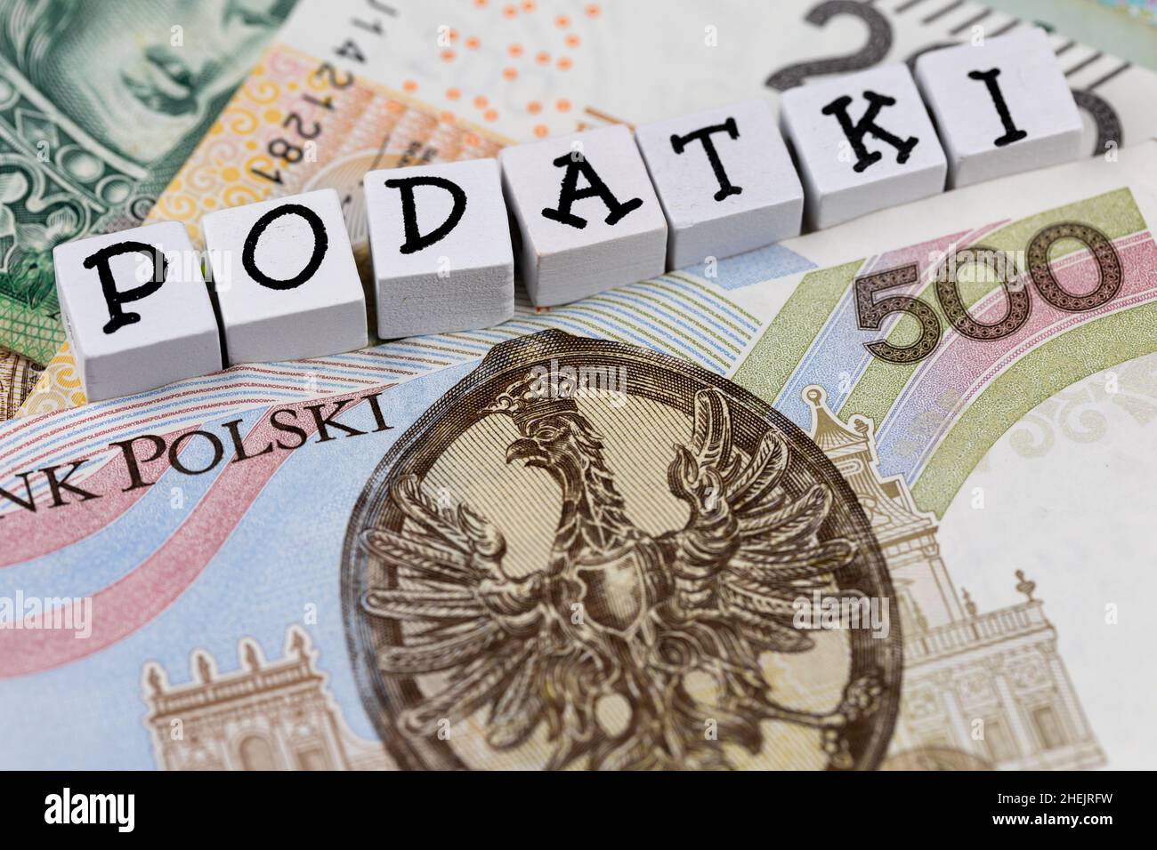 The wording "Podatki" translated as "Taxes" plus many Polish banknotes