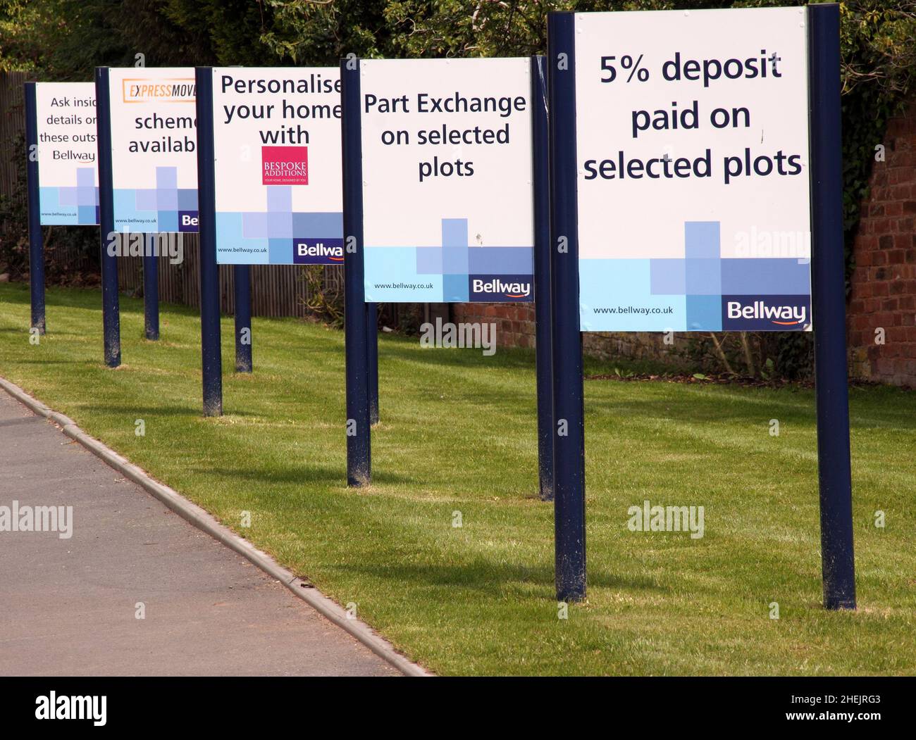 Signs outside Bellway Homes housing development encouraging buyers, deals, deposits paid, 2010 Stock Photo