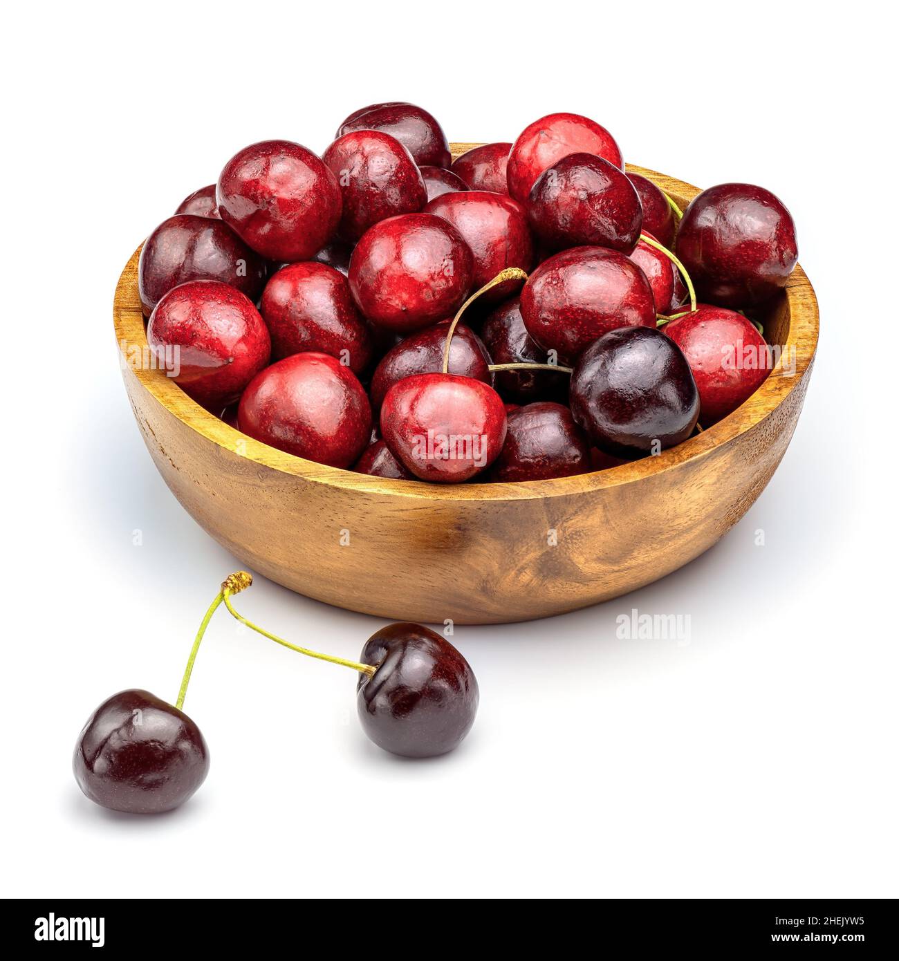 Fresh sweet cherries in wooden bowl isolated on white background. Cherry on white background. Stock Photo