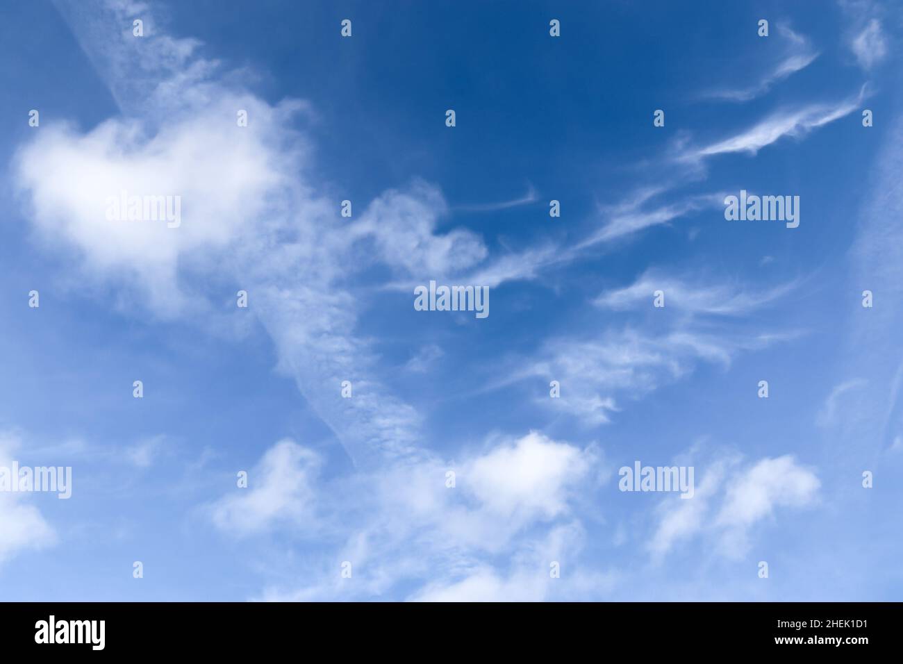 Stunning cirrus cloud formation panorama in a deep blue summer sky seen ...