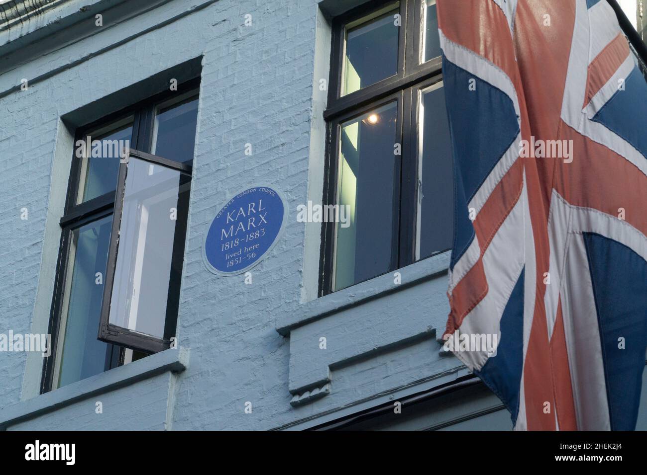 London, UK, 9 January 2022: On Greek Street in Soho a Blue Plaque put up by the old Greater London Council marks where Karl Marx and his family once l Stock Photo