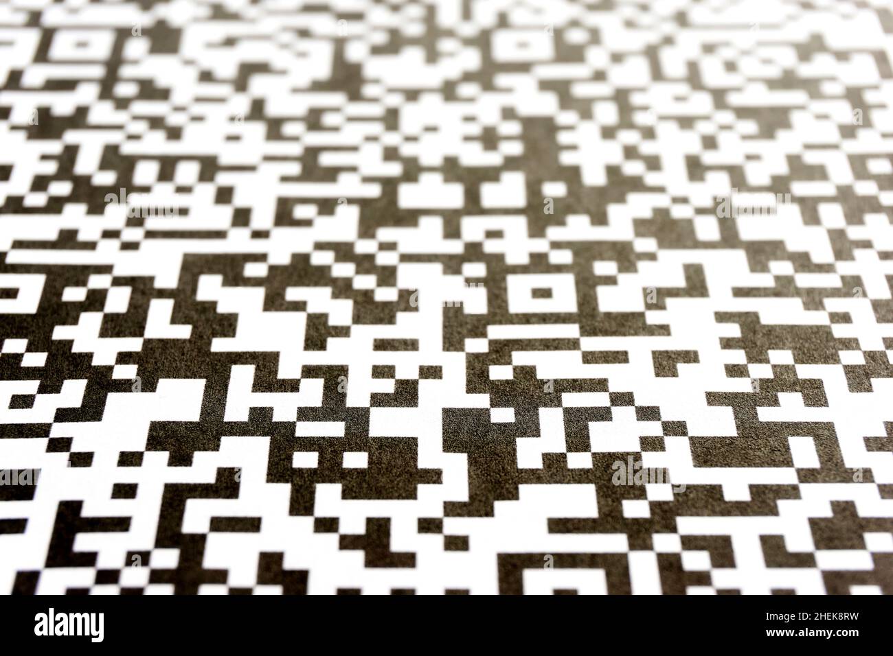 Close-up of QR code printed on paper. Abstract QR background in black and white. Stock Photo