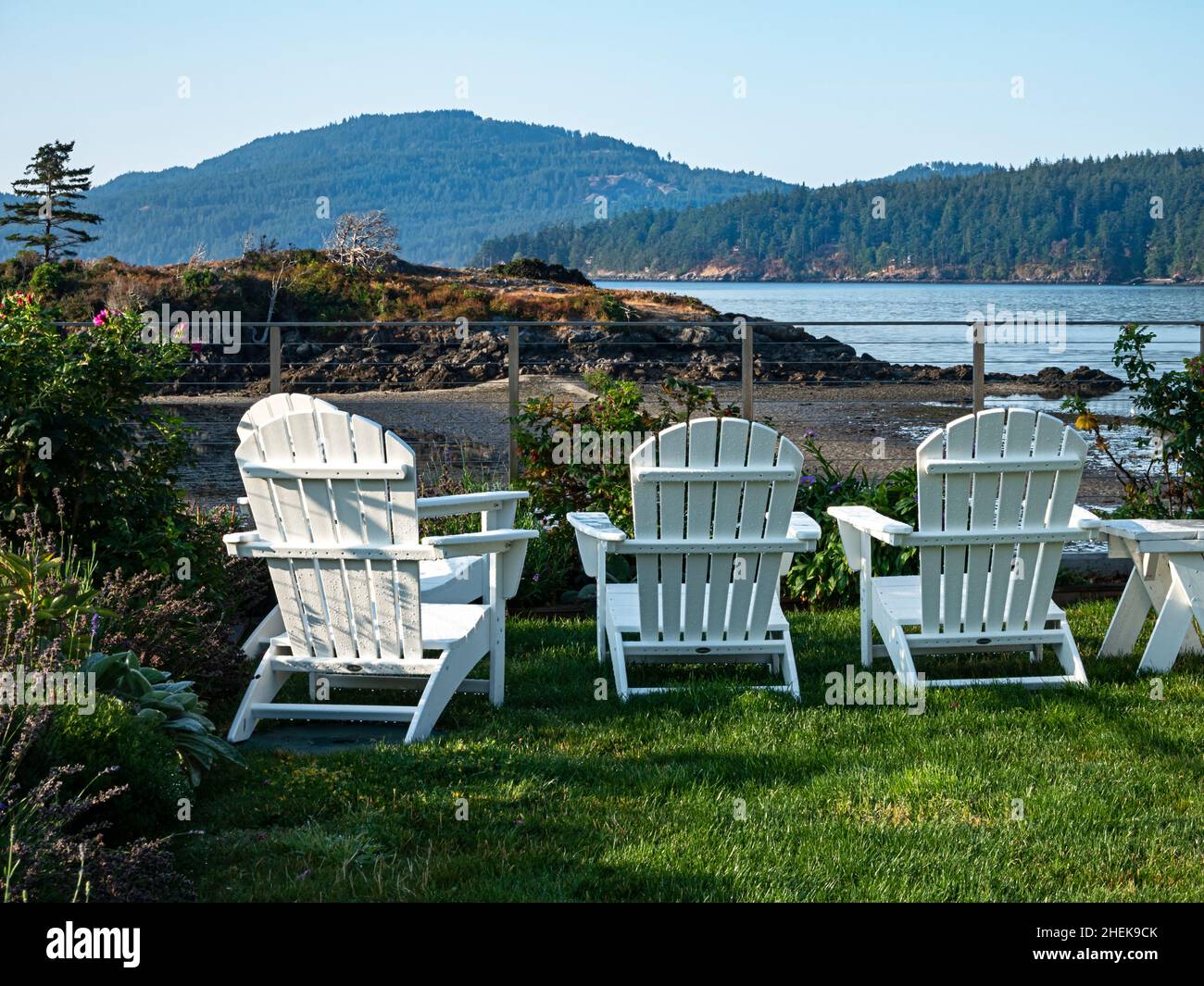 WA21066-00...WASHINGTON - Chairs overlooking the East Sound and Turtleback Mountain from the town of Eastsound on Orcas Island. Stock Photo