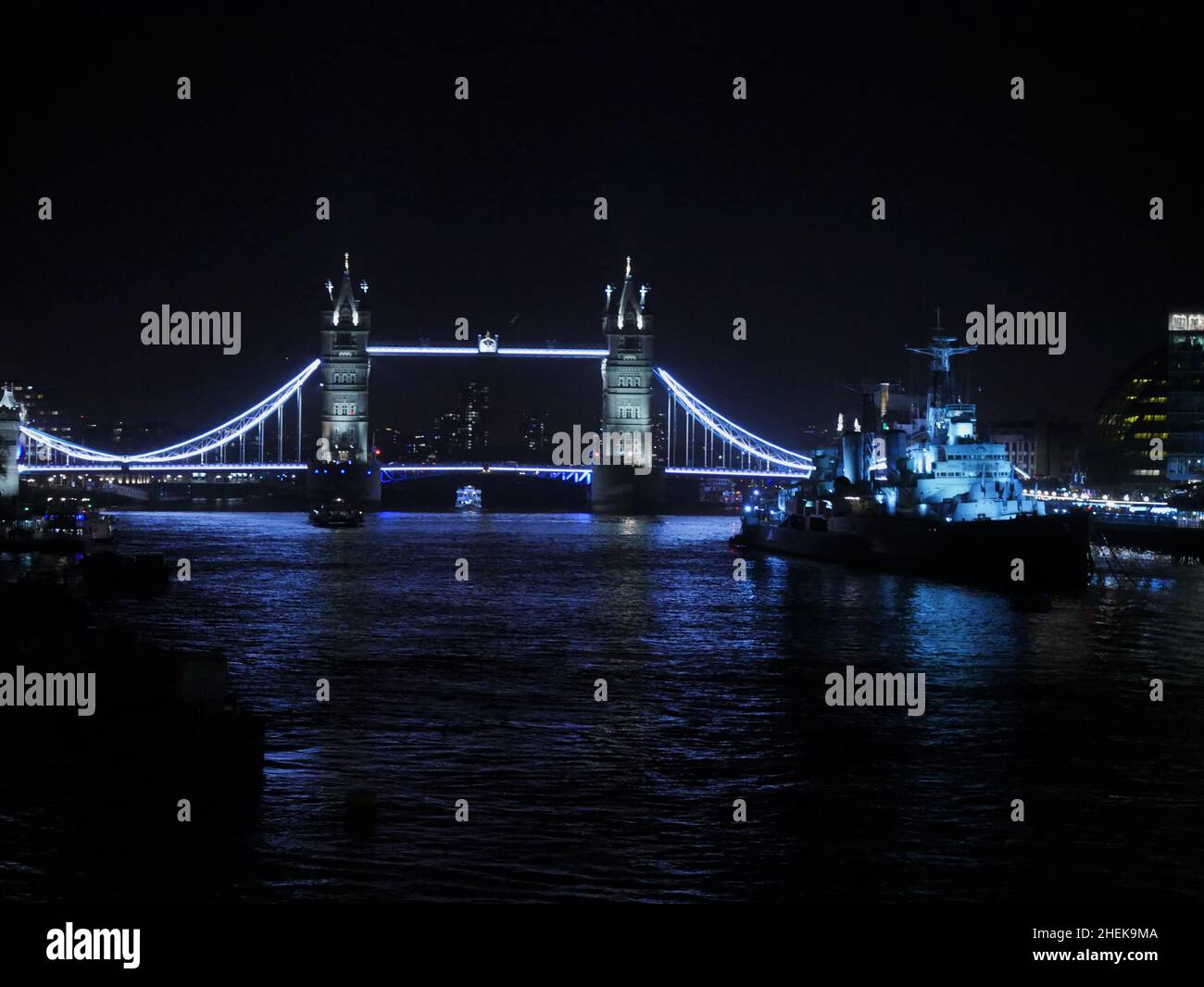 View of Tower Bridge from London Bridge on New Years Eve with HMS Belfast Stock Photo