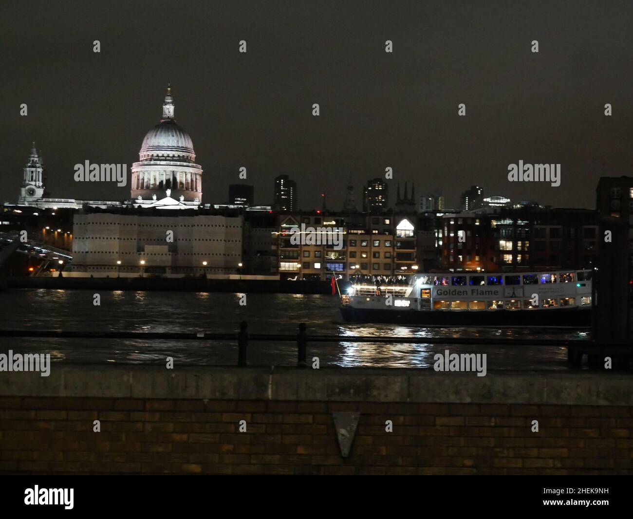 New Years Eve Party boat on the River Thames with St Pauls Cathedral in the background Stock Photo