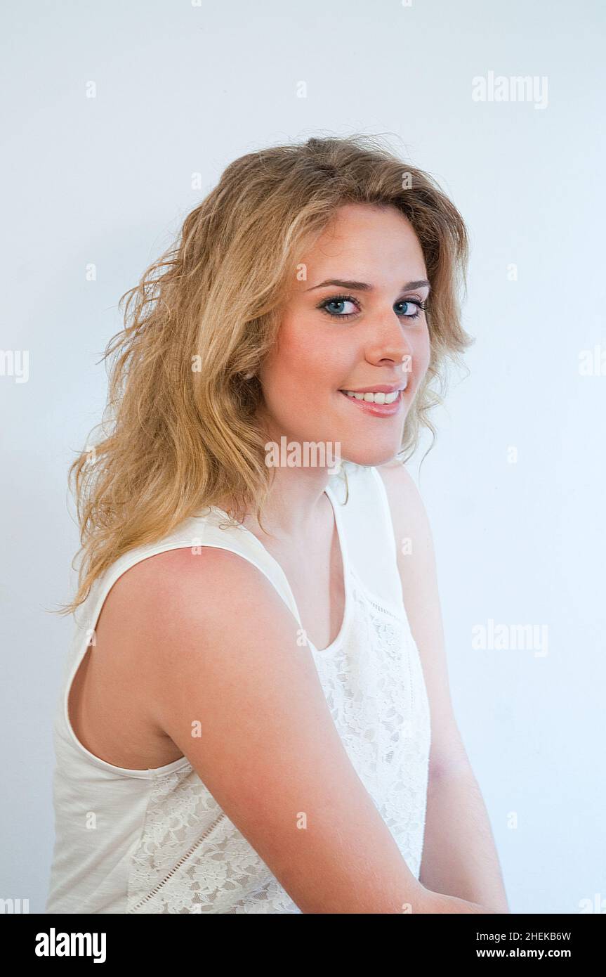 Young woman smiling and looking at the camera. Stock Photo