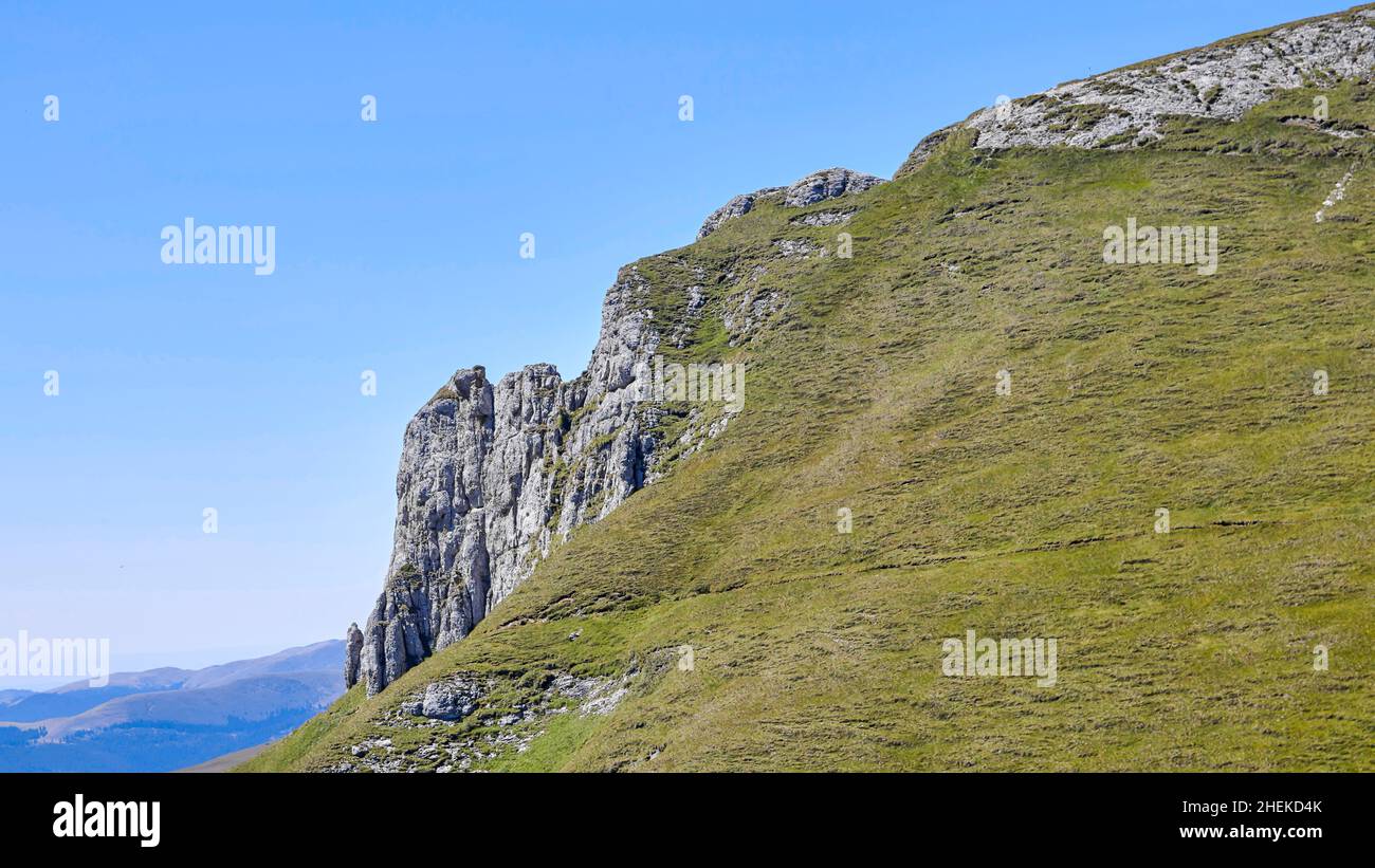 Where hills meet stone rocks Stock Photo - Alamy