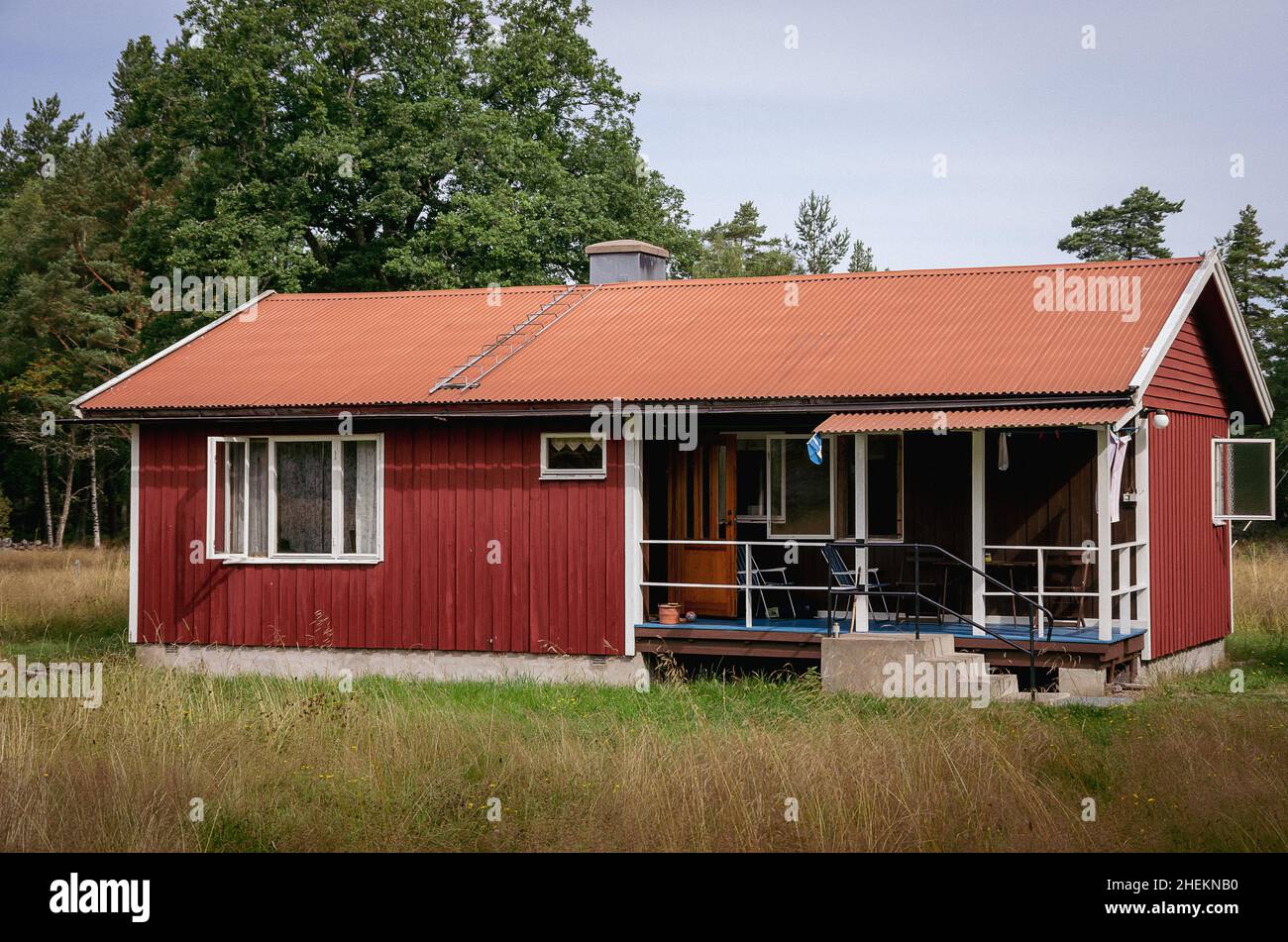 Symbolic image: Small wooden house in the style of a typical Swedish wooden hut. Stock Photo