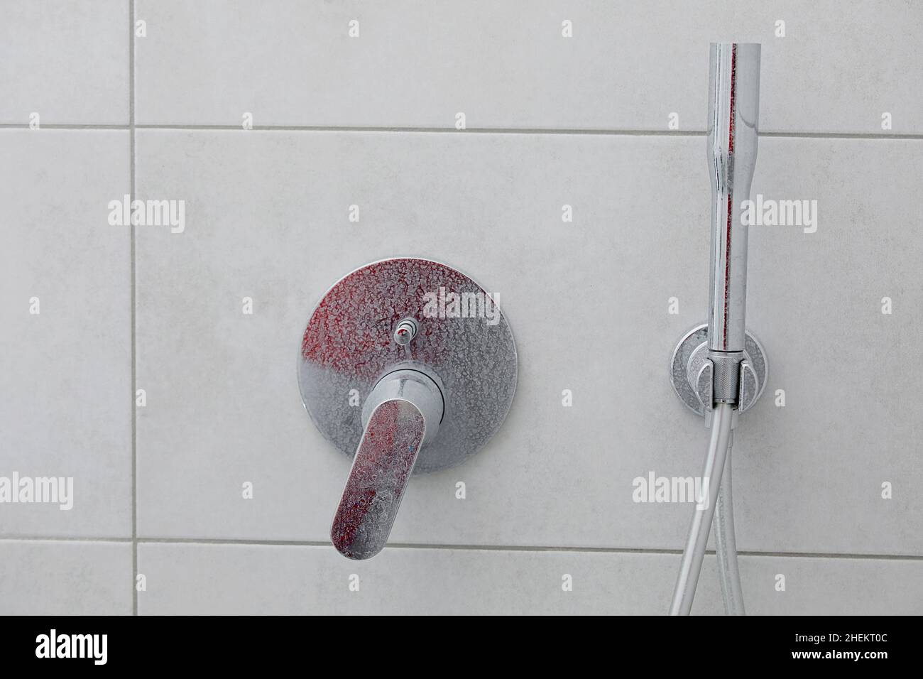 Dirty calcified shower mixer tap, faucet with limescale on it, plaque