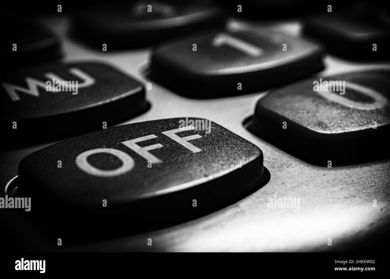 A harsh black and white treatment with vignette, calculator close up.Getting OFF at the corner. Stock Photo